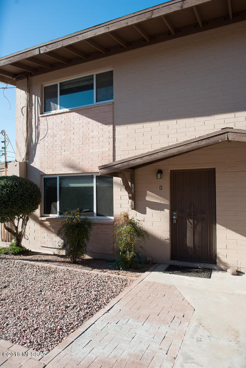 Warm, spacious condo located in central Tucson. Close to UA and shopping areas.  New custom interior paint throughout the home. Two large bedrooms upstairs with a Jack and Jill bathroom and walk in closet. Nice eat- in kitchen with ceramic tile and private back patio. Spacious carport and storage. Community pool. This property is in great condition and ready for your buyers!