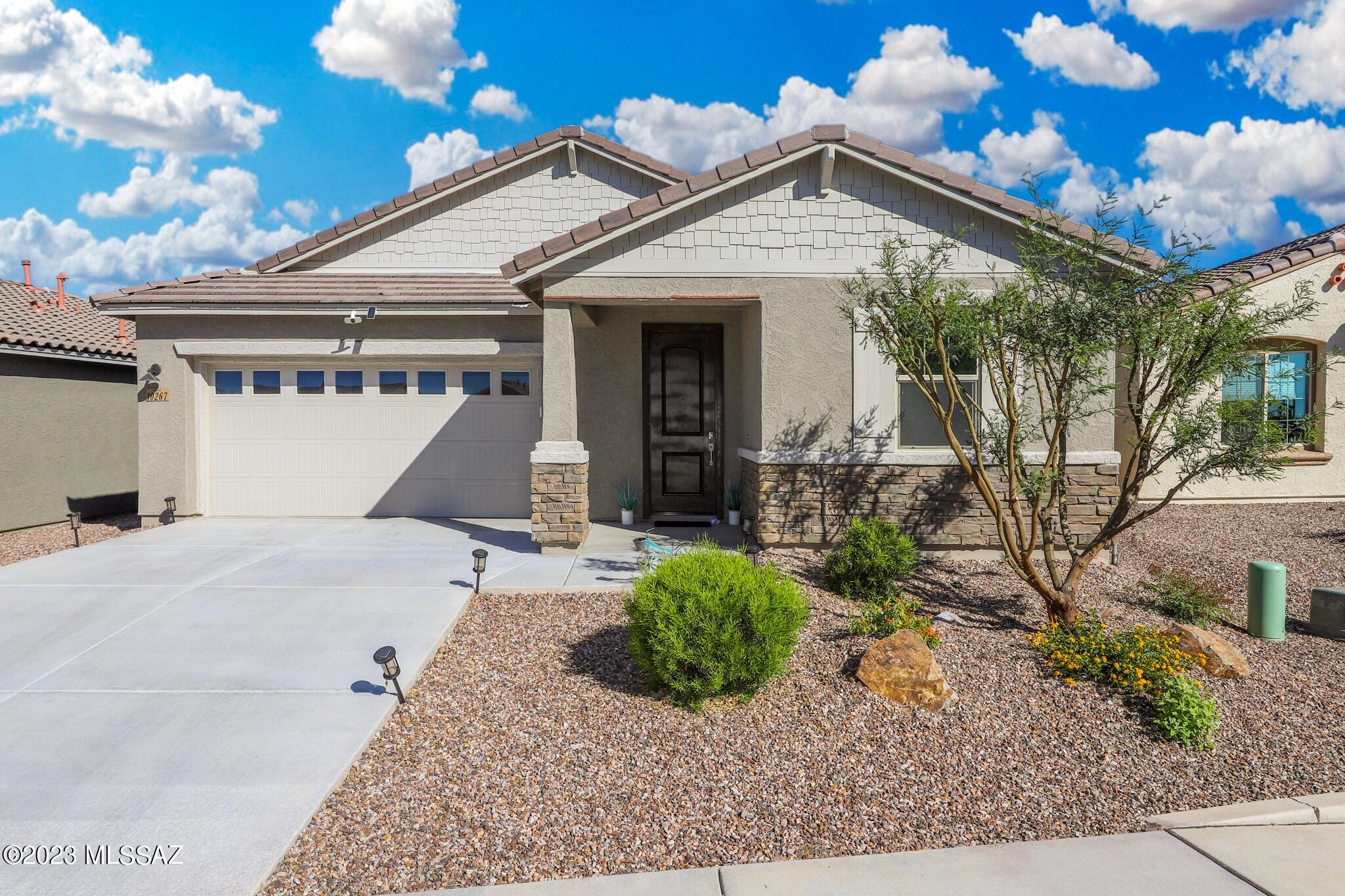 Check out this new build with a spacious layout, located in the highly sought-after Vail school district. This 3 bed, 2 bath home boasts a well-designed floor plan with a den (no pic), perfect for those who need an extra space for work, hobbies or formal dining. The open-concept kitchen is complete with modern, high-end finishes and quartz countertops and stainless-steel appliances. The bedrooms offer plenty of natural light and ample closet space, ensuring comfort and functionality. The two full baths are beautifully appointed with sleek fixtures and tiled floors. Additional features include a two-car garage, low-maintenance landscaping, and backyard, perfect for entertaining or simply enjoying the warm Arizona sun. Schedule your showing today!