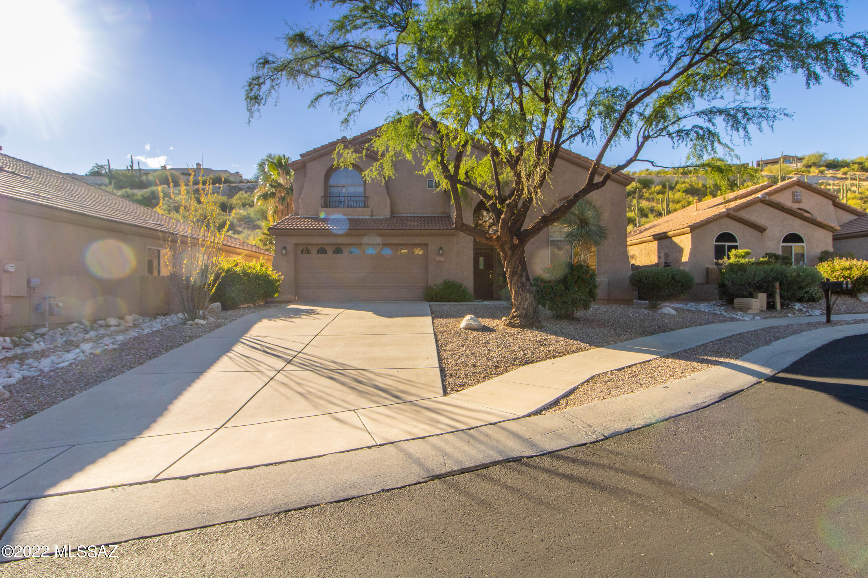 Beautifully maintained home in the Gated Sabino Mountain neighborhood on a Private Lot with Mountain Views. 5BR/3BA with full bath and 2 Bedrooms downstairs. Wonderfully Updated Island Kitchen w Granite Counters, Glass Tile Backsplash, SS Appliances. Open to Great Room w Fireplace. Separate Living/Dining room w Vaulted Ceilings. Lg Master Suite,Garden tub, shower, Dual Vanities, Lg Walk In Closet. Balcony Off Of Master Overlooks Beautiful Desert Common area and Mountain Views. Spacious Bedrooms with Plenty of Closet Space and Storage, water softener. Community Pool and Spa in the Neighborhood.