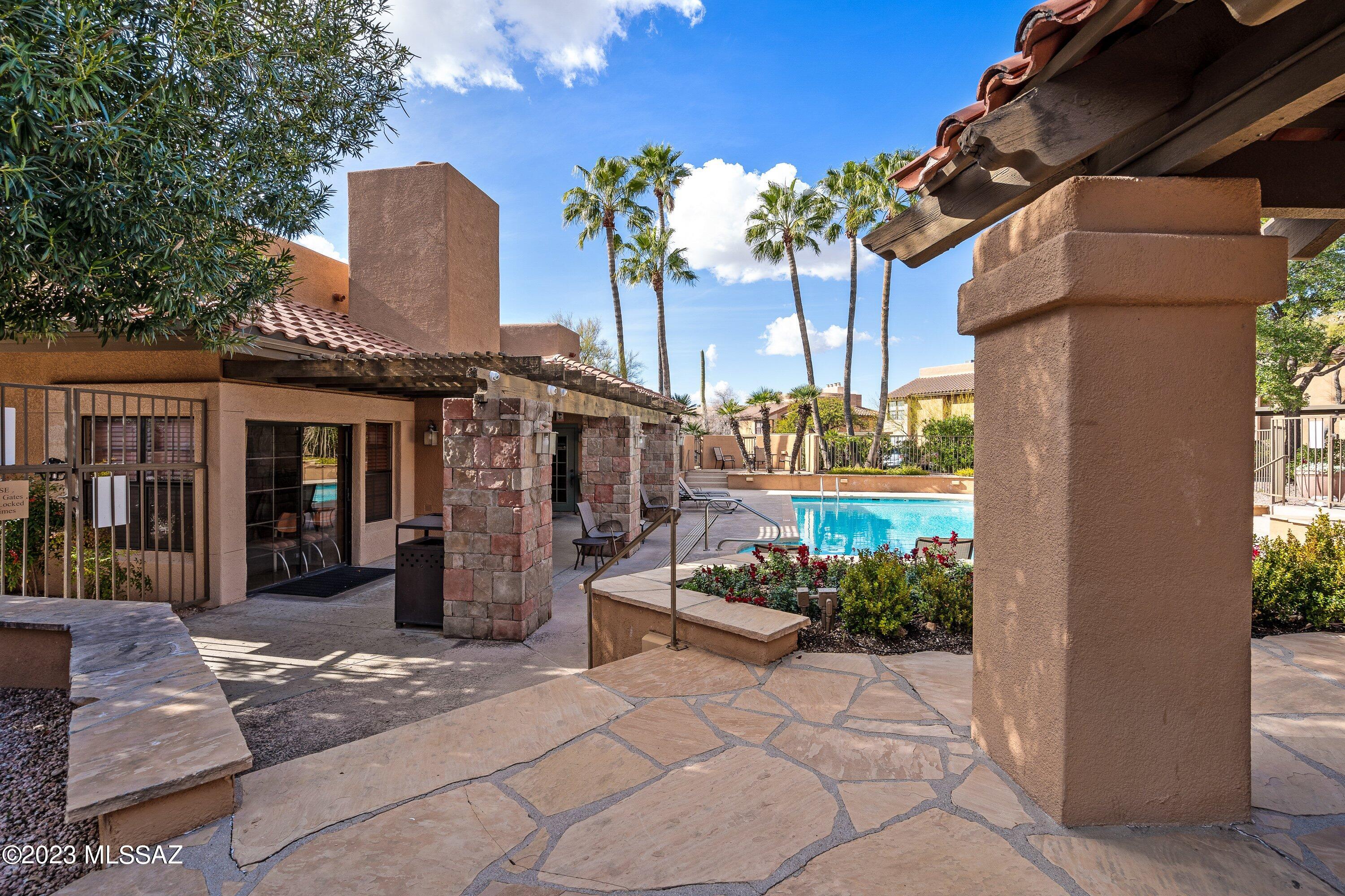 Rare opportunity in Catalina Foothills, community of Skyline Villas ground floor condo puts finest shops, restaurants and entertainment right at your fingertips! This well maintained property features an open floor plan, 2 bedrooms, 2 full baths, central A/C, granite tile counters, stainless steel appliances in the kitchen and natural wood burning fireplace in the living room. Great opportunity to enjoy the resort style of life that the complex is offering tennis courts, heated swimming pool/spa, club house and fitness centre.