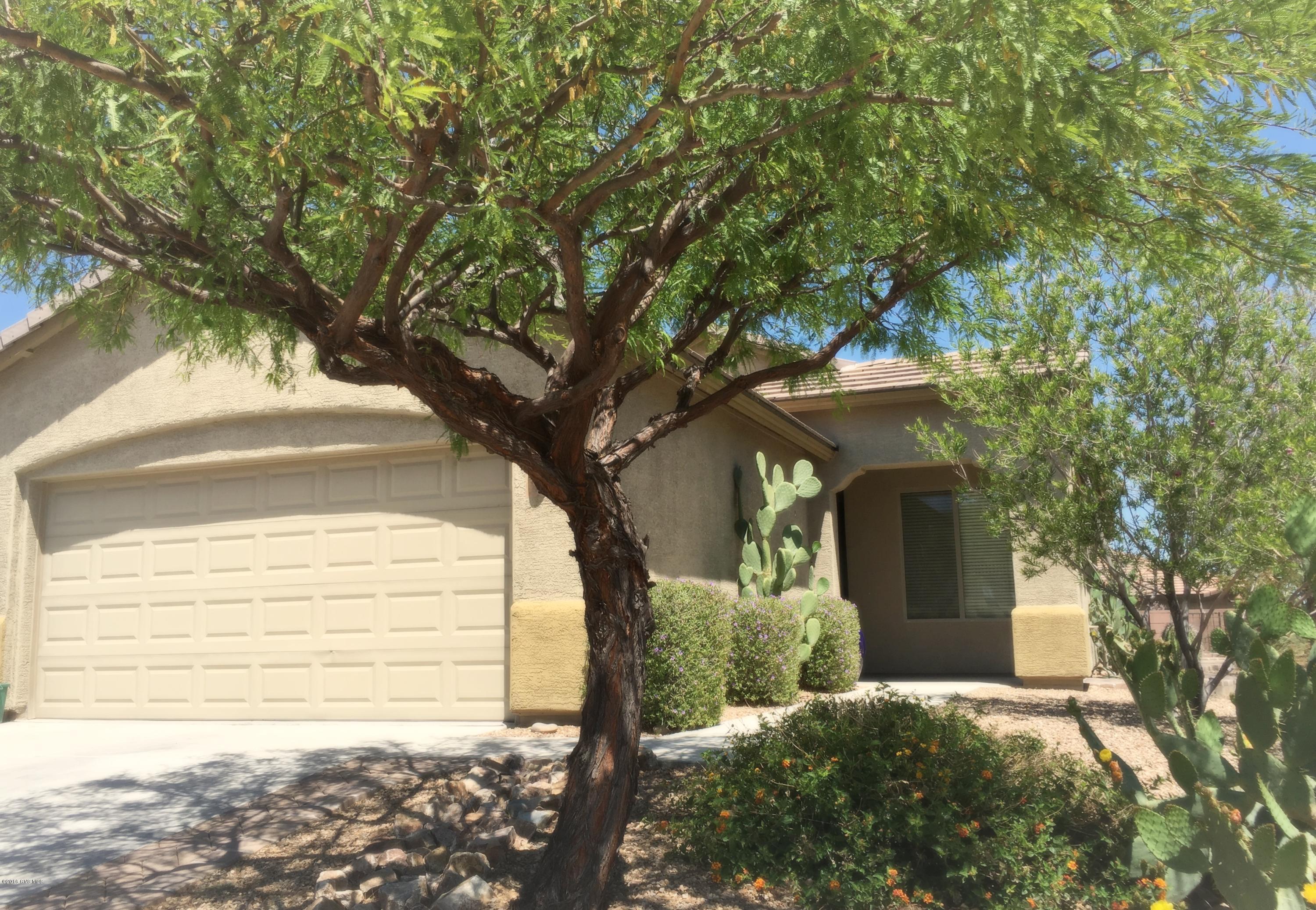 Lovely views from this large corner lot home. Walking into this home you are immediately drawn to the upgraded details such as lighting, 18'' tile and custom paint. The kitchen opens to the great room to allow for easy entertaining and has a convenient nook for informal dining. Off of the great room there is a flexible space which can be used as a den, office or even a formal dining area. The expansive master bedroom has additional space which can be used for an office or a crafting area. Step into the garage and you'll see plenty of storage options from cabinets to an additional area you can use as a workshop, golf cart parking or bike storage. Being on a corner lot, you will enjoy extra privacy while drinking in the amazing mountain views. Retirement doesn't get better than this!