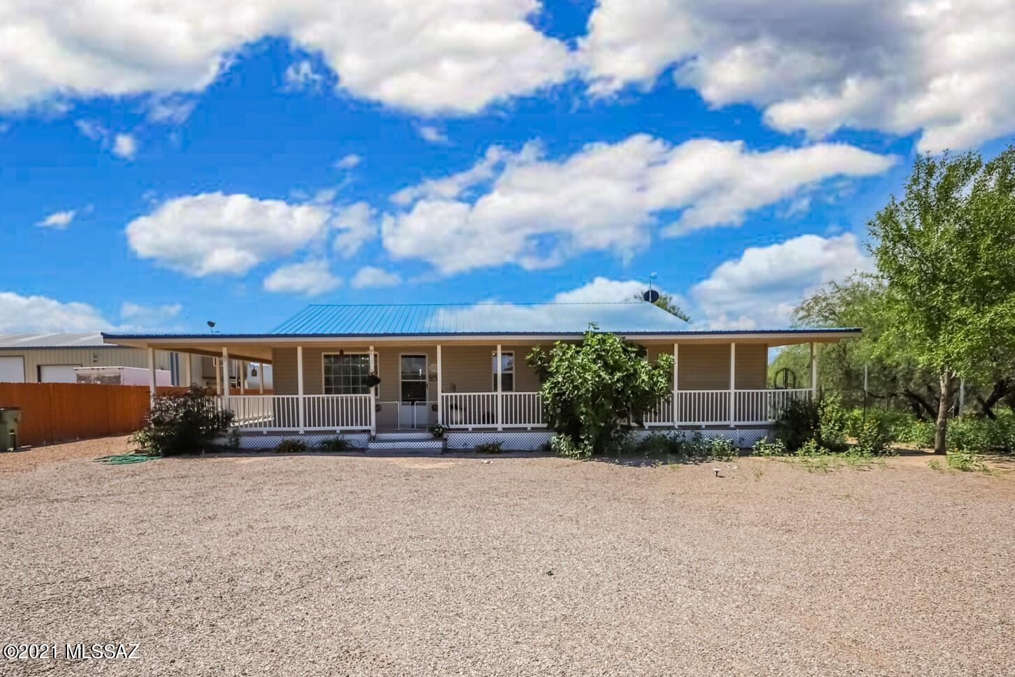 Beautiful, immaculate 3BD/2BA ranch home on 1 acre in Benson/Pomerene. Open floor plan, ceiling fans, wood laminate & tile floors throughout.  Light & bright kitchen features breakfast bar/island, newer appliances, dining area and plenty of cabinet space.  Spacious bedrooms, two with huge walk in closets. Main bedroom has large ensuite bathroom with vanity table. Hall bathroom has jetted tub and dual sinks. Fenced lot with gated entry, shed. Relax and enjoy the panoramic views from your huge covered porch. Come and take a look today!
