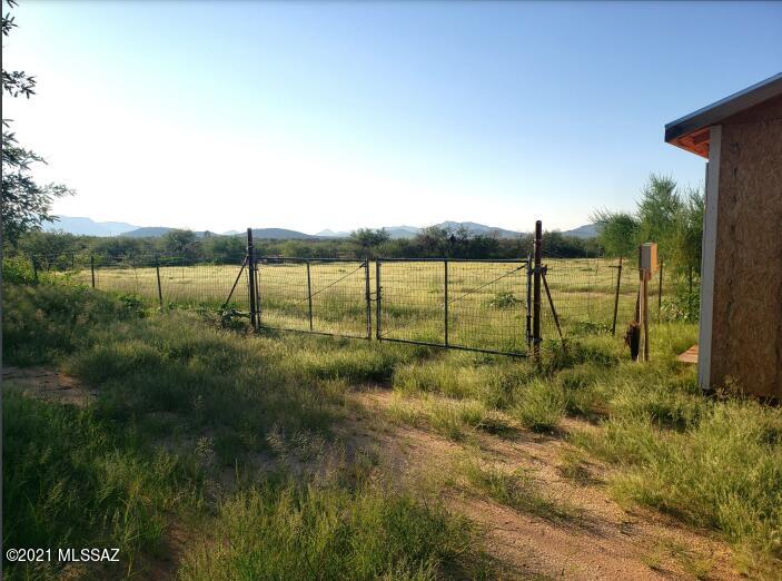 Private 7 acres with gorgeous views of mountains, TONS OF PRIVACY and FULLY FENCED!! Land has 2bed 1 bath 720sqft mobile home that has been well cared for, has newer Large AC unit, Separate laundry room, large Horse corral ready for horses, 
3 large 20x12 sheds, fruit trees throughout property on irrigation system, large storage container on wheels seller is open to offers for container.