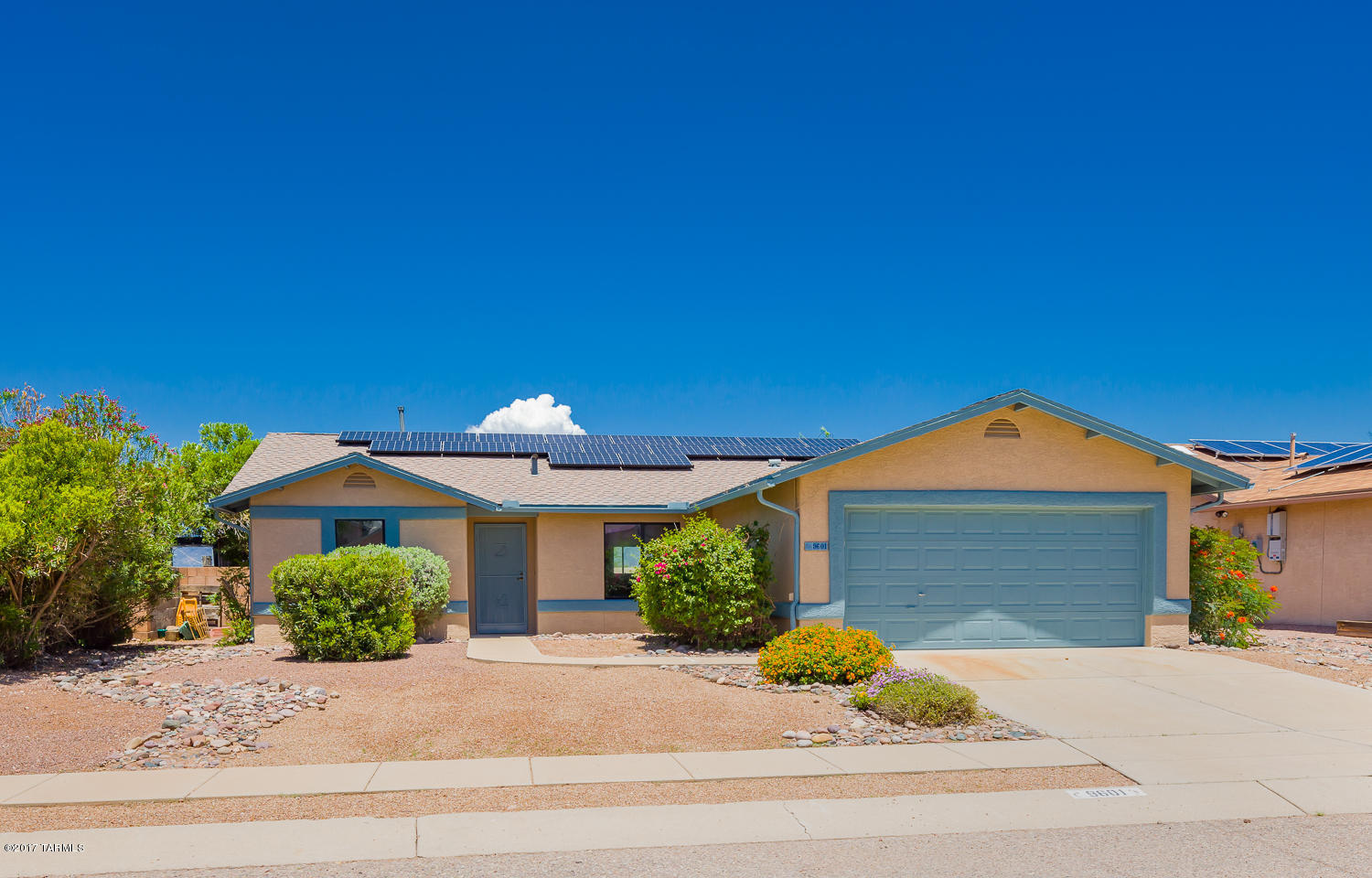 This inviting Rita Ranch home is a perfect retreat from the city. No neighbors behind for a clear mountain view from your back patio. Newer roof and high efficiency Air Conditioner. No Poly Pipes! Fresh paint, Bought & Paid for Solar Panels with Solar City. Elegant stone fireplace, and a private, cozy feel. Make this home yours today!