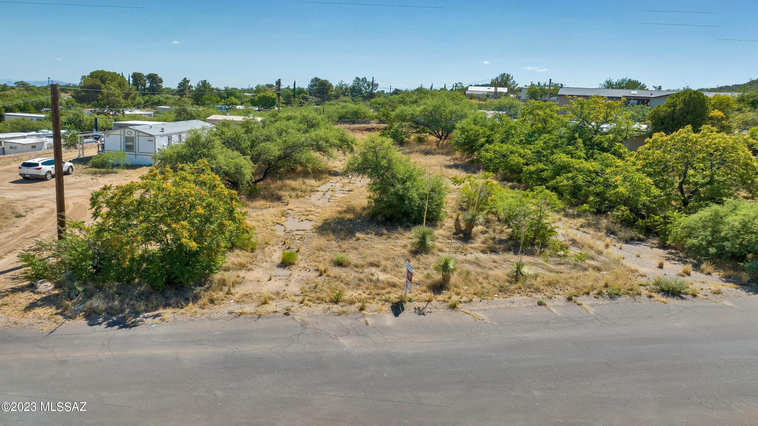 Level lot with lush desert landscaping, providing privacy from the road and your neighbors. This is an ideal location in the heart of Oracle with all of its amenities and ease of access to Hwy 77 for heading to Tucson or the mountains. Come enjoy the cooler temps in Oracle and all we have to offer! 

County has approved a variance to allow for a new single family home or manufactured home to be placed on the property, but it cannot be larger than 130'x50' and must adhere to variance specifications. Power pedestal must be moved to accomodate a double wide manufactured home or single family home.