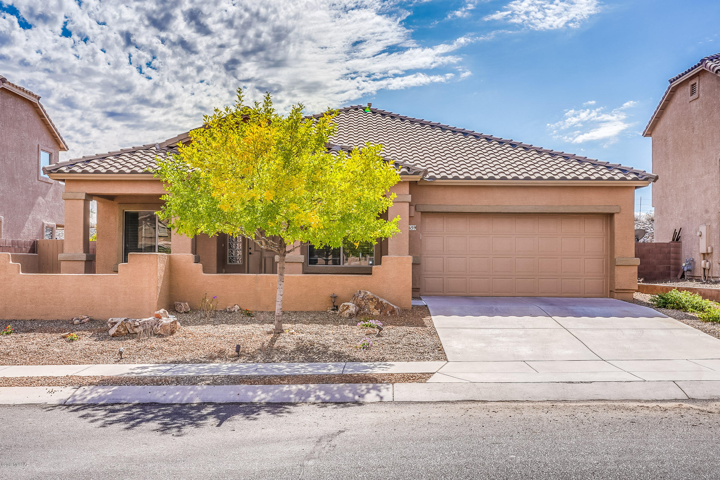Located in the heart of Oro Valley! This pristine single owner home, located in the  beautiful community of Tangerine Terrace is ready for new owners! Open floor plan is complemented with natural light in all rooms. Enjoy cooking and entertaining in the spacious kitchen with glass cooktop, wall oven, spacious counters-Island, and huge pantry. Over-sized porch is great for enjoying the beautiful views of the Catalina mountains. Premium lot offers extra privacy. Conveniently located near shopping and restaurants. Did we mention the top performing schools! Come see this lovely home today.