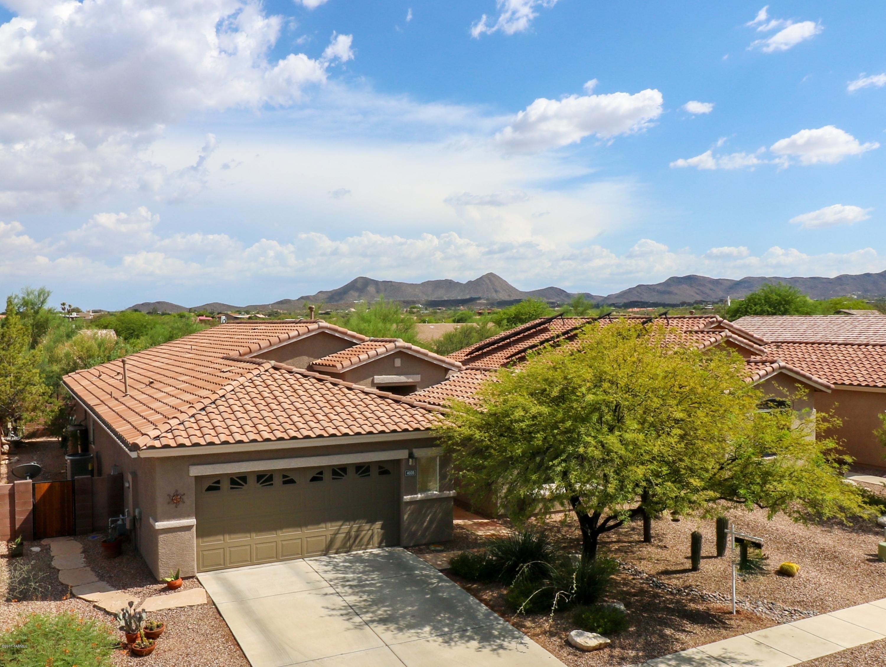 Gorgeous turn-key home in the Tucson Mountains! This meticulously maintained property is move in ready! Enjoy a bright and open floor plan with spacious rooms, soaring ceilings, and spa!  New heater and AC installed in 2017. Located in a quiet gated community with easy access to the I-10, U of A and Downtown.