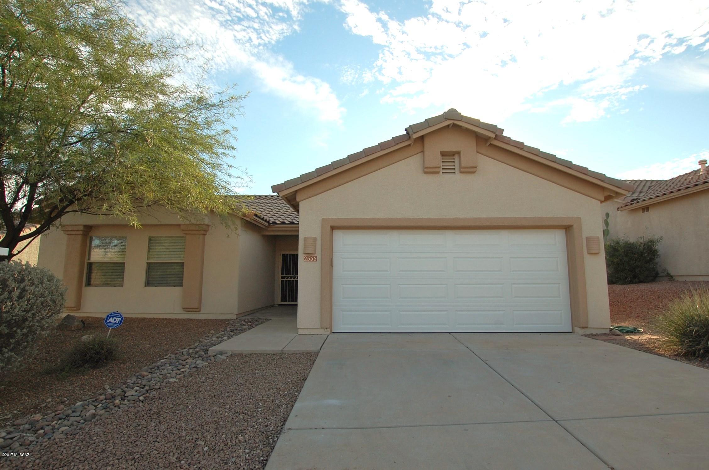 A must see, this beautiful 3 bedroom 2 bathroom home has ceramic tile throughout the living area, a welcoming great room with vaulted ceilings and a fireplace. The great room is open to the upgraded kitchen which includes stainless appliances, granite countertops and an island for extra working space. The master bedroom features high ceilings and a walk-in closet. Other features include wainscoting in the second bedroom and an upgraded guest bath. With plantation shutters throughout and a large laundry room this home checks all the boxes. Head outside to find a large yard with mature landscaping and privacy thanks to the common area backdrop. Come call this home yours and act quick, this one won't last!