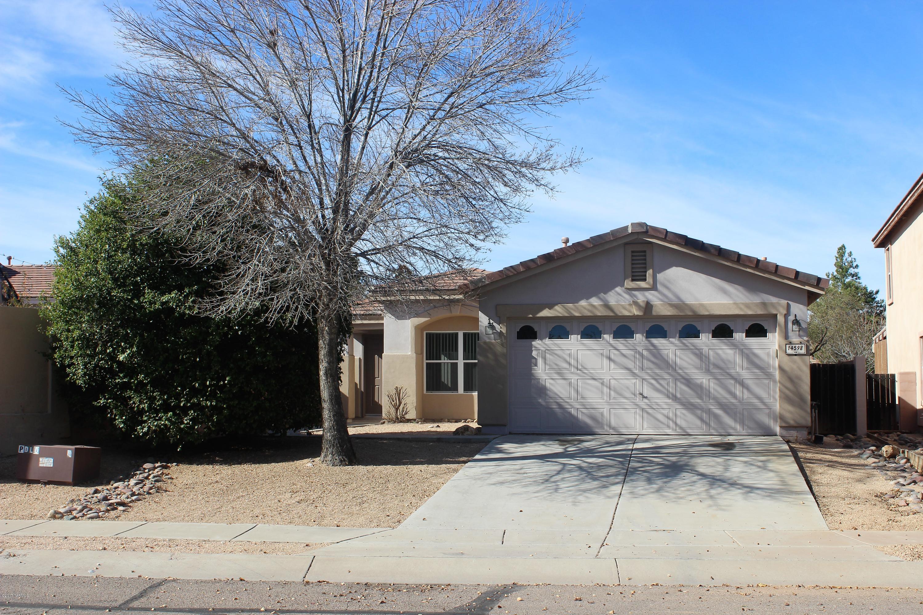 Looking for a home in sought after Rancho Sahuarita community? You have found your next home! This beautiful contemporary one-story home has 3 bedrooms, 2 bathrooms, den, and much more! Open layout, kitchen island, fireplace, large backyard. No one behind you in the backyard. Prewired for alarm system. Go swimming at the Community pool & spa. Close to shopping, restaurants, schools, parks, rec center, and Hwy I-19. Don't miss out on this great opportunity! Come SEE and MAKE AN OFFER today!
