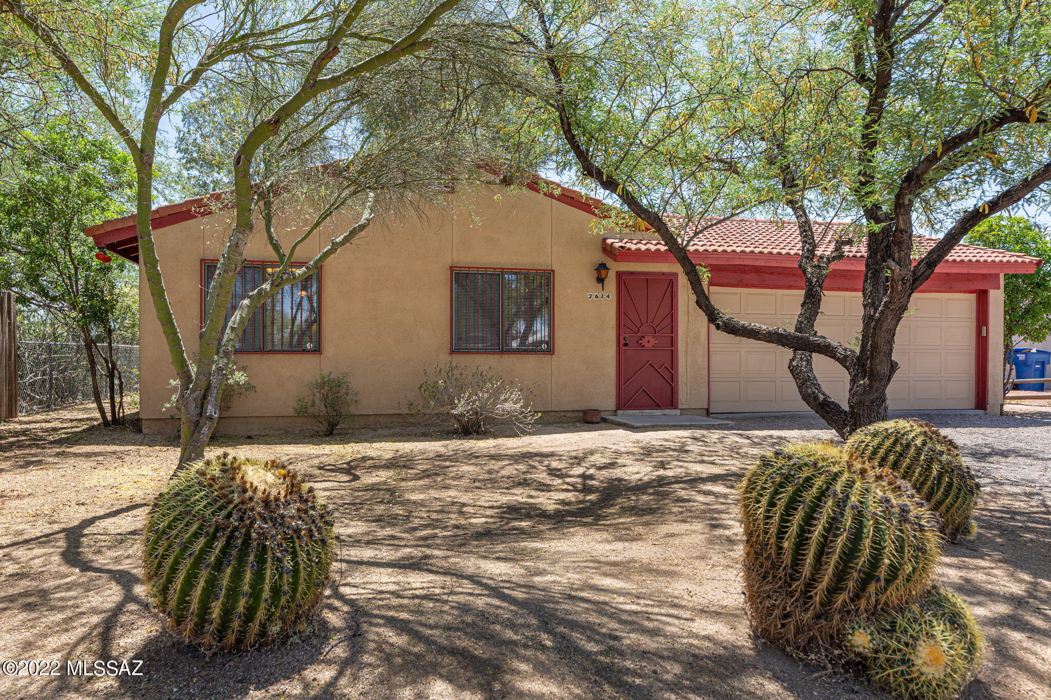 Fantastic 3 bedroom and 2 bath home, recently painted exterior and NEW modern paint pallet on the inside.  Wood looking tile throughout this awesome home!  Located close to U of A campus,  Mitchell Park,  as well as Salpointe  Catholic High School, and the River Loop is not far away!.  This is a well kept home in a friendly neighborhood.  Soaring vaulted ceilings make this home feel spacious and inviting. Featuring a warm cozy fireplace in the living room,  you will be very comfortable on those chilly nights we have here in the Sonoran Desert.  In the back yard there is a custom built covered patio that is perfect for gathering with friends and family.  With a large 2 car garage, your cars will not sit out in the elements. This is also a great place to store toys or even have a work shop. For showing instruction please contact the listing agent.