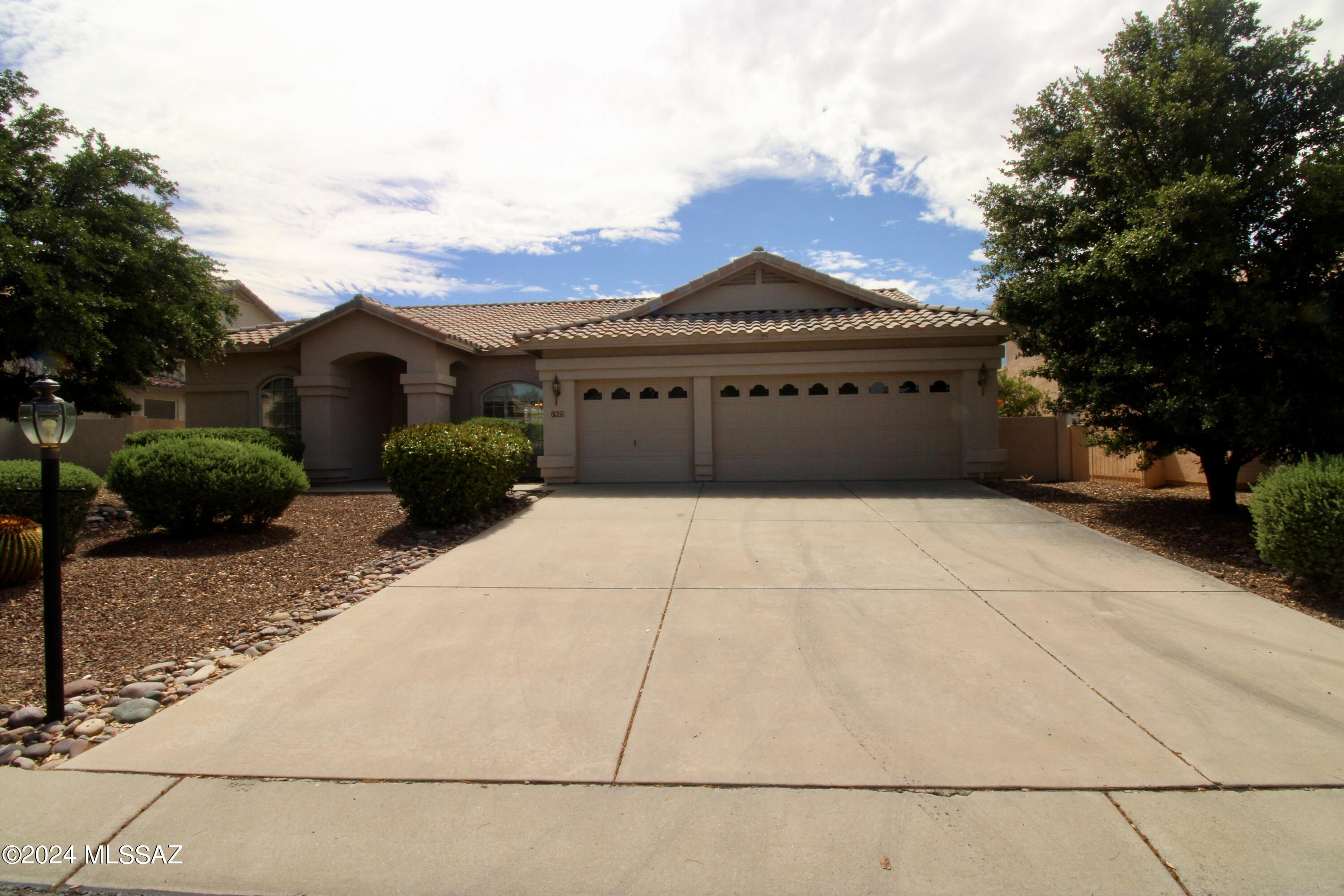 **MOVE IN READY! APPLICATION FEES CREDITED BACK AT MOVE-IN!**
2,318 SQ. FT. 3 bedroom/3 bathroom home. Charming single-story floor plan. Neutral interior with wood-style vinyl plank flooring throughout. Spacious open floor plan, great for entertaining! Great room flows to the kitchen + additional living room with fireplace! Kitchen boasts included appliances + pantry + ample cabinetry! Blinds and ceiling fans throughout! Two sliding glass doors leading out to the patio! Spacious bedrooms! Master suite offers a huge walk-in closet and ensuite bath. Laundry room with washer + dryer included! 3 car garage! Enjoy the outdoors year-round on a covered patio! Beautiful views from the master bed and living room. Convenient Tucson location; located close to groceries, hospitals, walking trails.