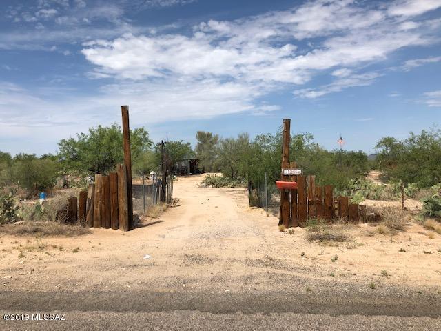 Listed as Vacant Land, but has a 2 bedroom 1976 un-affixed mobile home with a 510 sq. ft. 1985 addition.  The real value is in the land on a paved road, but the mobile and addition are livable. Can be split once with RH zoning.  It is completely fenced in and comes with a number of outbuildings needing attention.