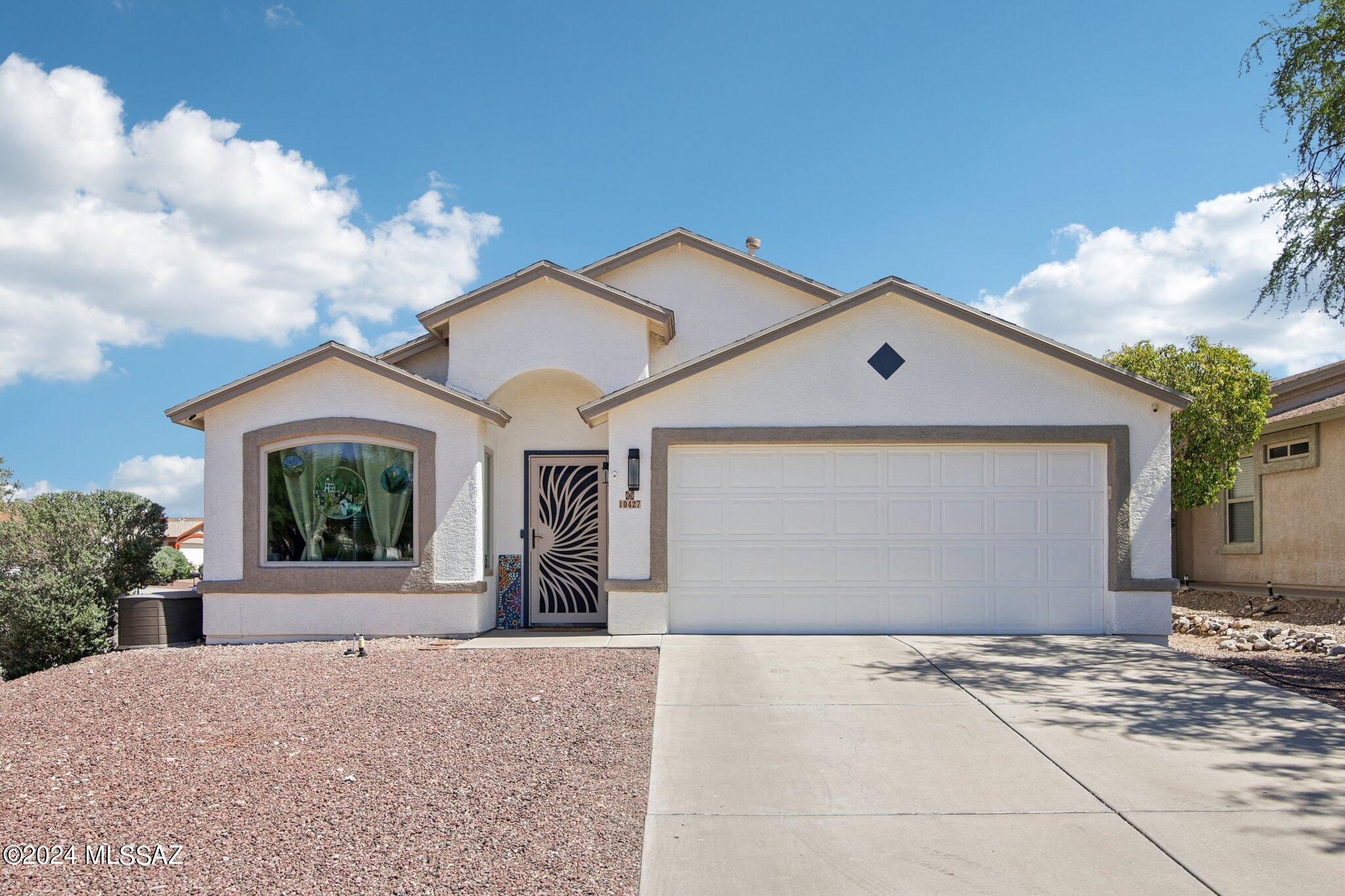 Welcome to this lovely 4-bedroom, 2-bathroom home, perfectly situated on a corner lot within the prestigious Vail School District. This home exudes charm and has been meticulously cared for, boasting a gorgeous remodeled kitchen featuring a large island, pendant lighting, ample cabinet space, quartz countertops, stainless steel appliances, a beverage fridge and more.

The spacious master bedroom offers a sizable walk-in closet with built-ins, and the refreshing master bathroom features both a shower and soaking tub, custom tile surround, dual sink vanity with chic mirrors, and modern lighting. Additional upgrades throughout the home include light fixtures and a cozy gas fireplace in the living room. Step outside to the beautifully manicured backyard, complete with a covered patio and bursts of colorful flowers, creating an ideal space for relaxation and privacy. The home has seen many updates in recent years, including a new AC, water heater, windows, water softener/reverse osmosis system, and vibrant landscaping, providing enhanced comfort and efficiency. Conveniently located near restaurants, stores, hiking trails, parks, Tucson Loop, and with easy access to I-10, this home offers both luxury and practicality. Don't miss the opportunity to make this your dream home!