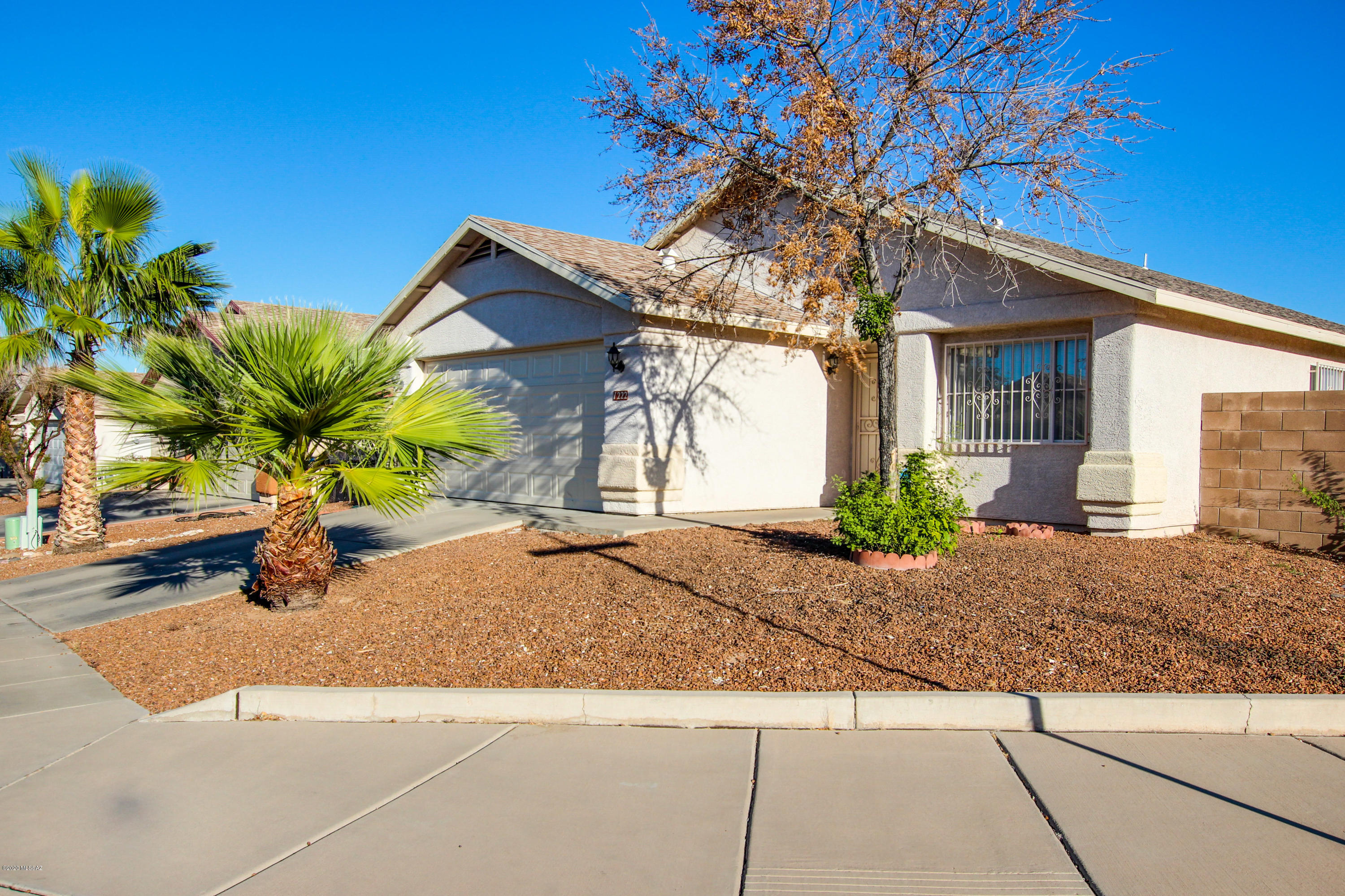 Great mountain views! Wonderful 3 bedroom, 2 bathroom home available in desirable Rancho De Colinas and resting on a corner lot. Ideal floor-plan offers separate living and family rooms, open kitchen with gas range, breakfast bar and SS appliances.  Master retreat includes a walk-in closet and a private en-suite with dual sinks. Other features include a NEW HVAC, water heater, garbage disposal and garage door. Enjoy the views from the backyard with covered patio and a blank slate for your imagiation. Don't miss this West side community, nestled along the Tucson foothills, near parks, shopping, restaurants and within easy reach of the I-10 and downtown. Come take a look.