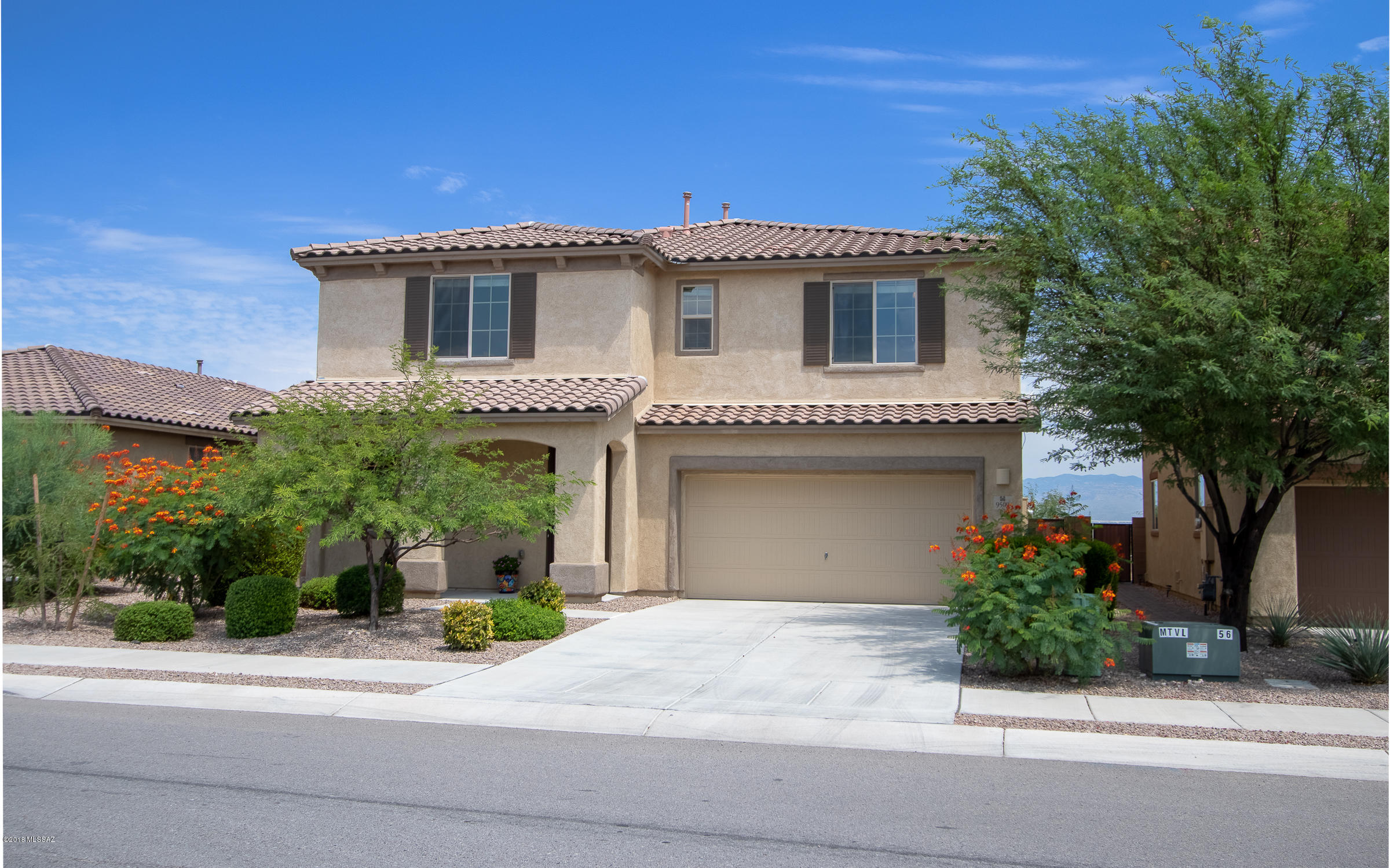 No rear neighbors! Backs to state owned land with north Catalina Mountain views from your backyard. This beautiful home has a 3 car garage, 2 full baths & main level powder room, 4BDRM, loft den, large GREAT RM with beautiful granite counters, mocha color stained cabinetry, neutral color tile, large bedrooms w/ walk in closets. Built in 2014 and looks like new - only better! All has been completed. Neighborhood school allows the kids to be close to home. Come check the wonderful home first! All the bedrooms and Laundry room are on the second level.