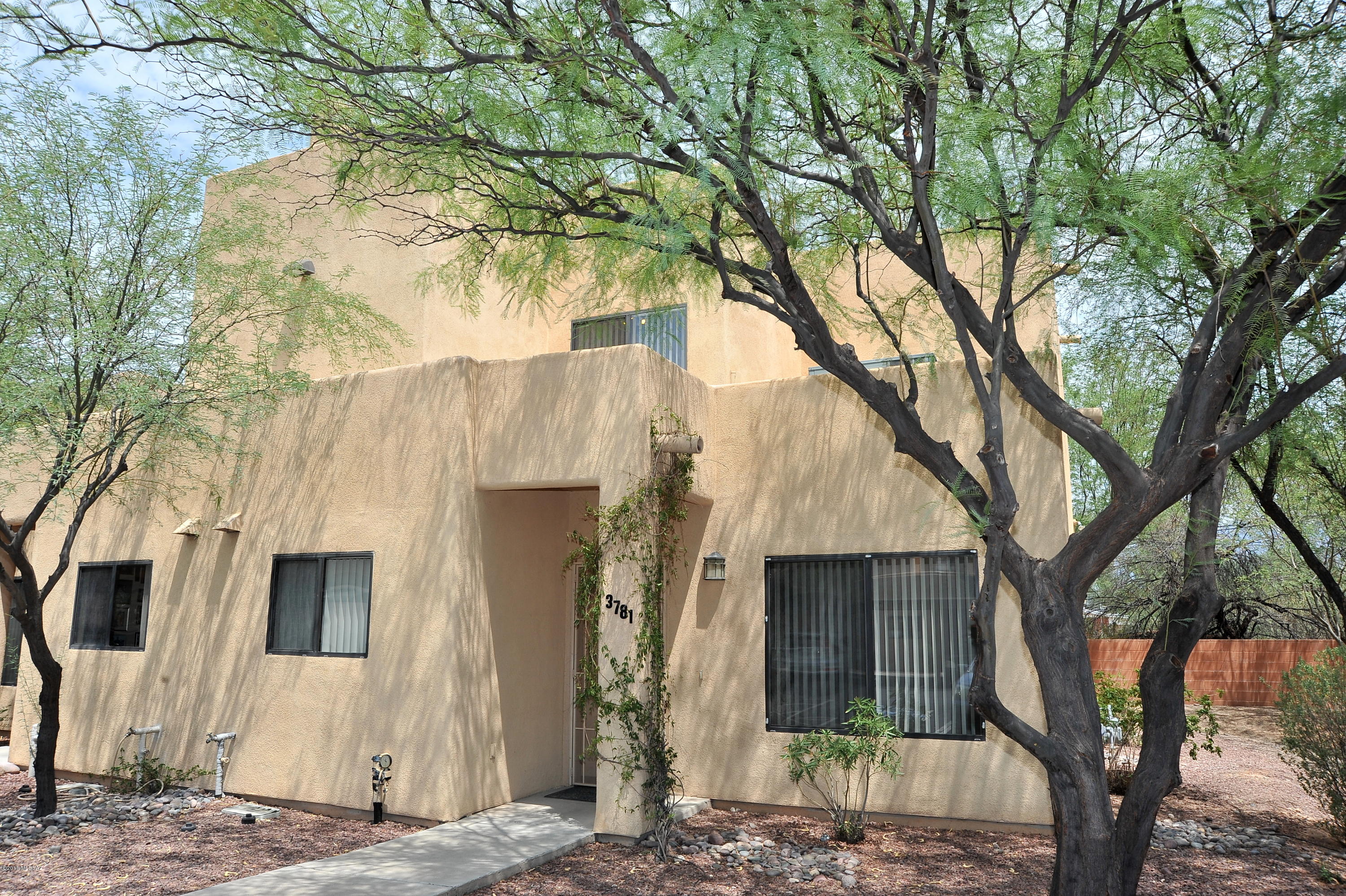 Welcome to your midtown Oasis! Take the private driveway to this small & quiet complex located within minutes of UofA, restaurants & shopping, and the Botanical Garden. This charming townhouse built in 2006 is an updated end-unit and offers privacy and beautiful mountain views from the newly landscaped backyard. Other recent upgrades include high quality tile in kitchen & bathroom, designer paint & updated light fixtures. 3 BR's & 2 full BA's, each with dual sinks. Other features include large pantry, interior sprinkler system, extra storage area. Assigned covered parking for 2 cars in front of unit. All appliances stay. Professionally cleaned and move-in ready. HOA covers insurance, exterior maintenance, trash, and sewer. One of the sellers is a licensed real estate agent in Arizona.