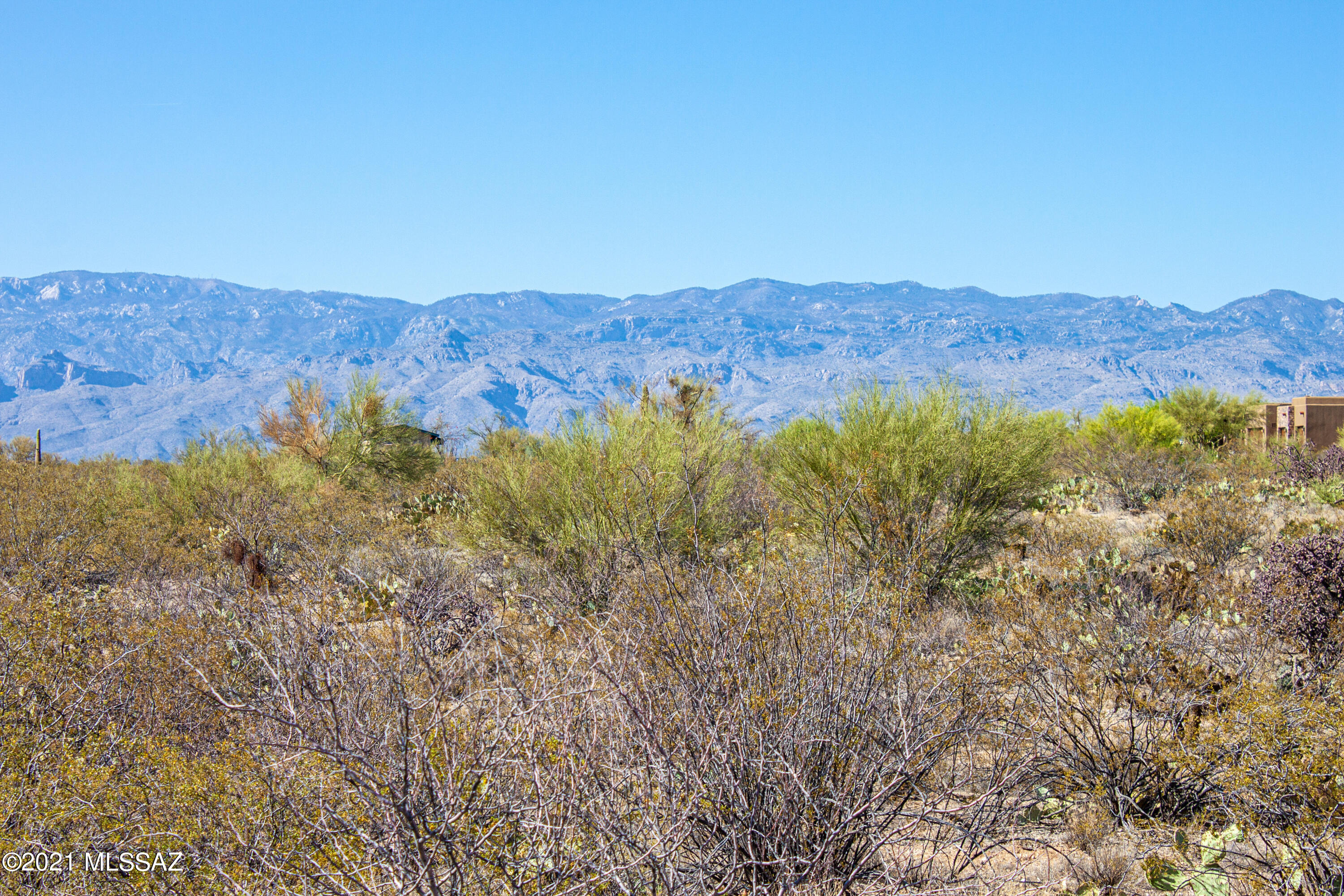 Unbelievable Views of all of the Tucson Mountain ranges from this 3.31 acre lot located walking distance to the Saguaro Monument Park East and a mile away from the new Northwest Hospital facility. Also located adjacent to the Hukelberry Loop.  Lot offers many buildable areas.  Surrounded by custom homes and gated for privacy. One of the best lots in the community.  Tanque Verde School District. Located near hiking, biking and riding trails.