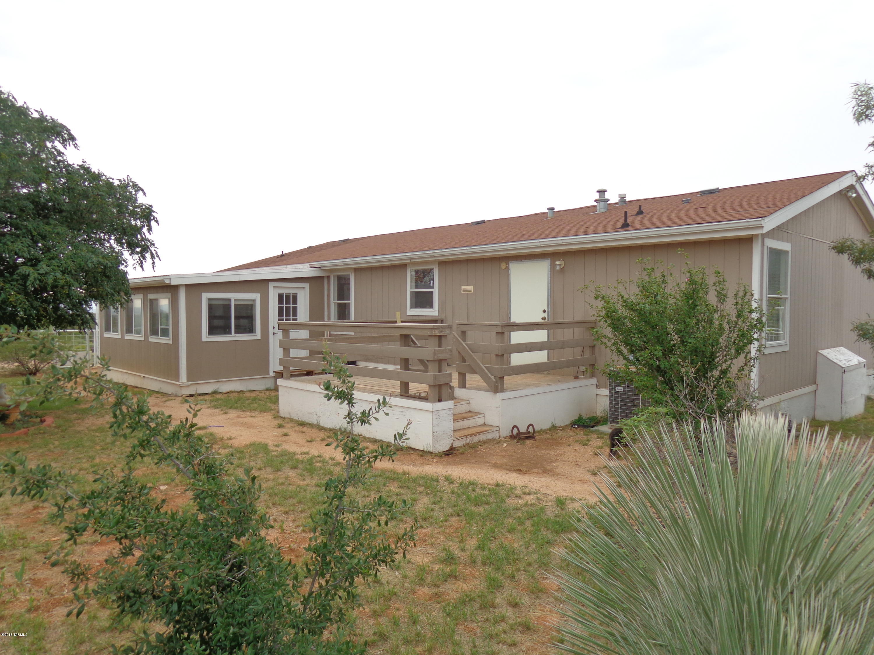 1600 sq ft MFH built in 2000 w/4 bed 2full bath and Az rm. Attached to the home are both a rear and ft deck,the ft being covered from which you can relax and enjoy the view. Steel pipe and chain link fenced yard. Perfect size horse property. Centrally located between Benson and Willcox w/beautiful mountain views and half a mile off Dragoon rd. 17 fully fenced acres w/multiple shaded corrals,small arena,steel livestock working fac,10 ton capacity hay barn,fully enclosed tackrm,storage rm and insulated office area plumbed w/water and electric and evap cooler. Extensive poultry facilities. Abundant,fresh, clear water from a private well. Easy access to public land for riding and hiking. At a additional cost there is a 70acre state lease. Talk to agent about different splits if needed