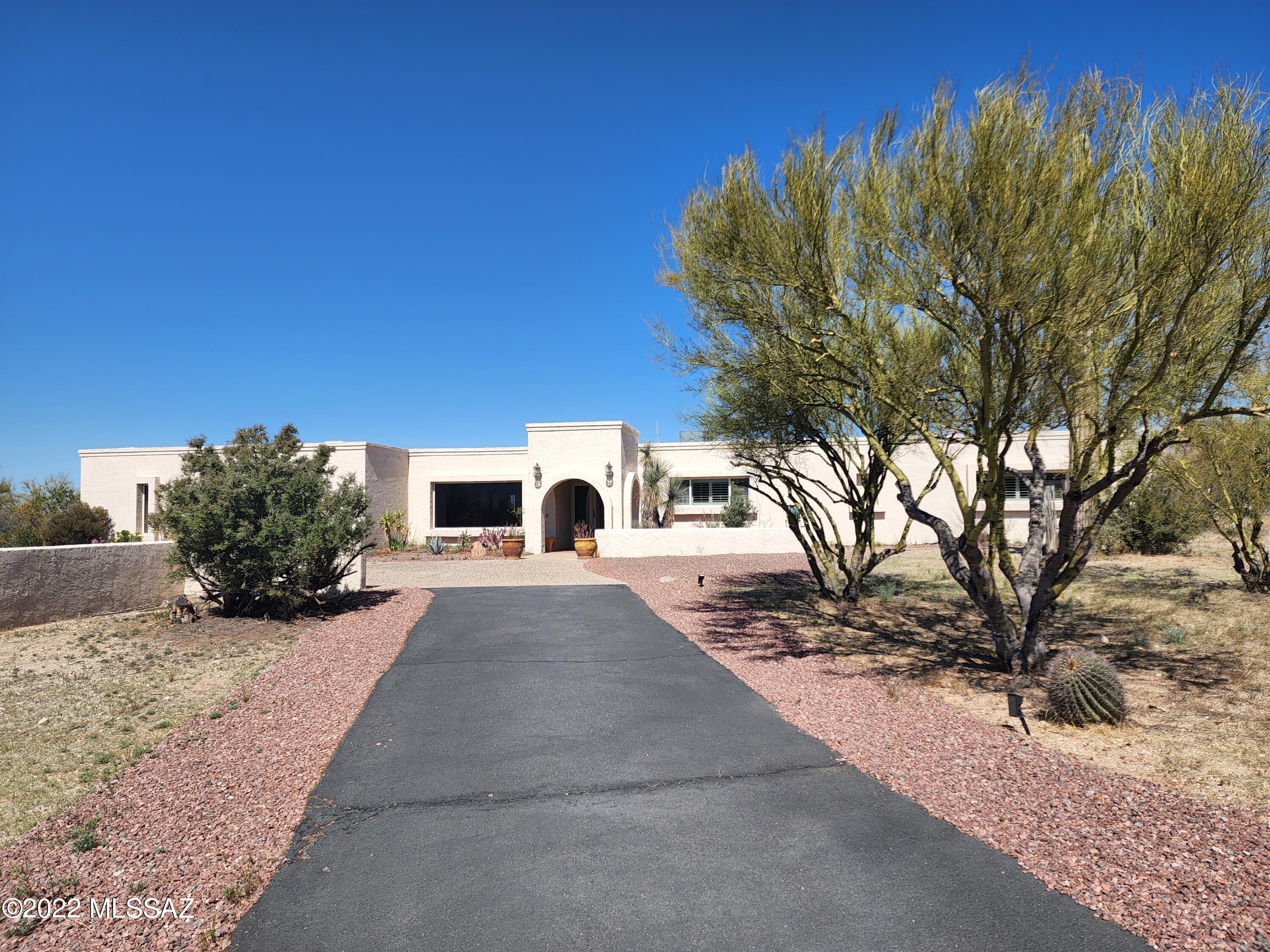 Private Eastside Home that Features a Main House, 4 bedroom 3 bathroom and Guest House, 2 bedroom 2 bathroom.  Newly Remodeled Gourmet Kitchen with Stainless Steel Appliances.  Granite Countertops and Gorgeous Cabinets.  Also, Features a Swimming Pool and 5 Car Garage.  Beautiful Mountain Views and Plenty of Space for Entertaining.  LANDSCAPING AND POOL SERVICE ARE INCLUDED!