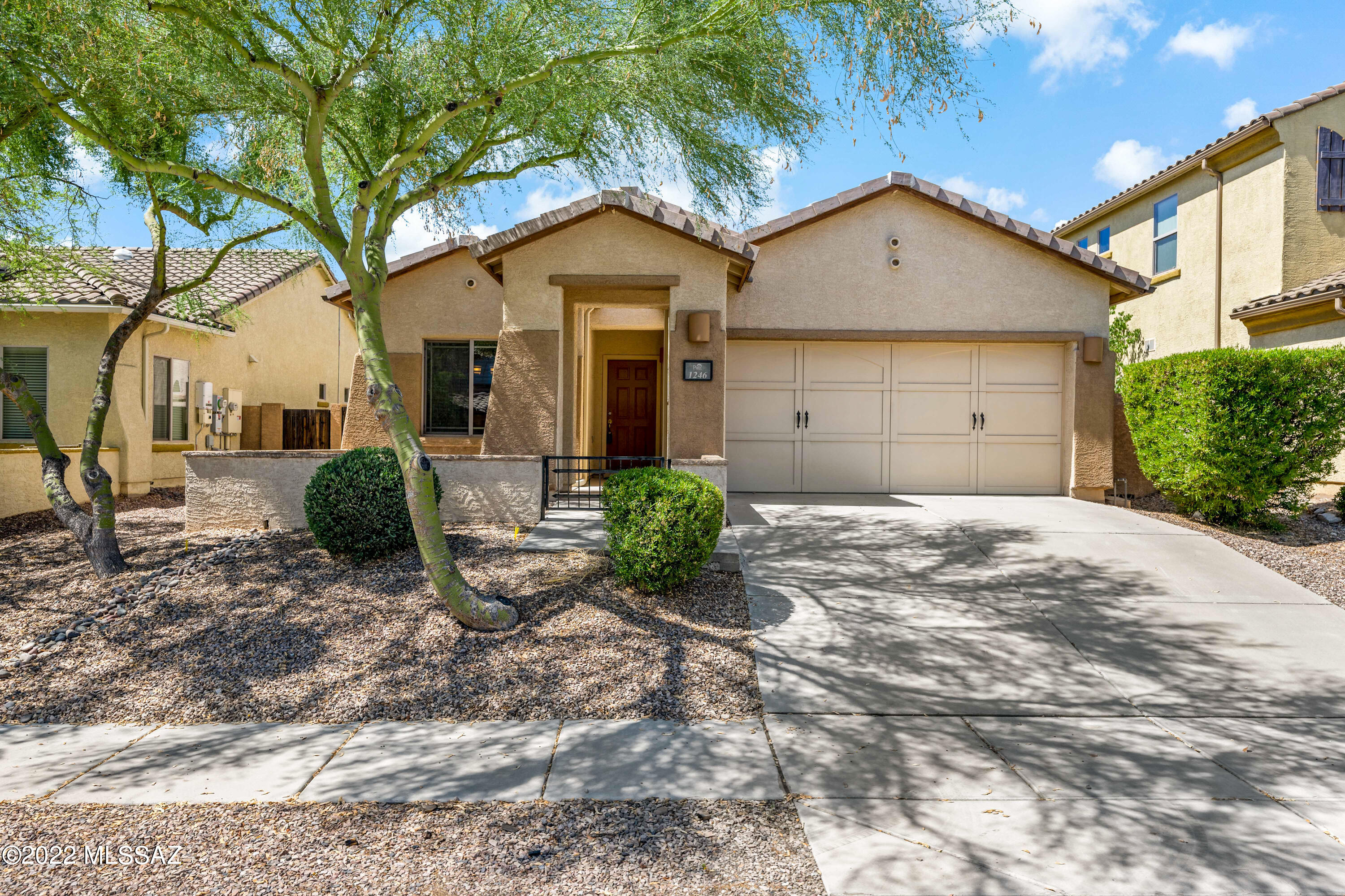 This lovely home in the heart of Oro Valley welcomes you with a gated courtyard. As you enter you'll find an impressive living space boasting an open concept great room with fireplace for modern living. Spacious Chef's kitchen suited with massive island separate dining area with plenty of cabinet & counter space. 3 Bedroom 2 bath home with large rear yard. Master suite hosts a soaking tub, walk-in shower & closet.
Ceiling fans throughout. Washer and Dryer convey. Enjoy the easy quite living of Rancho Vistoso in this well-maintained neighborhood.