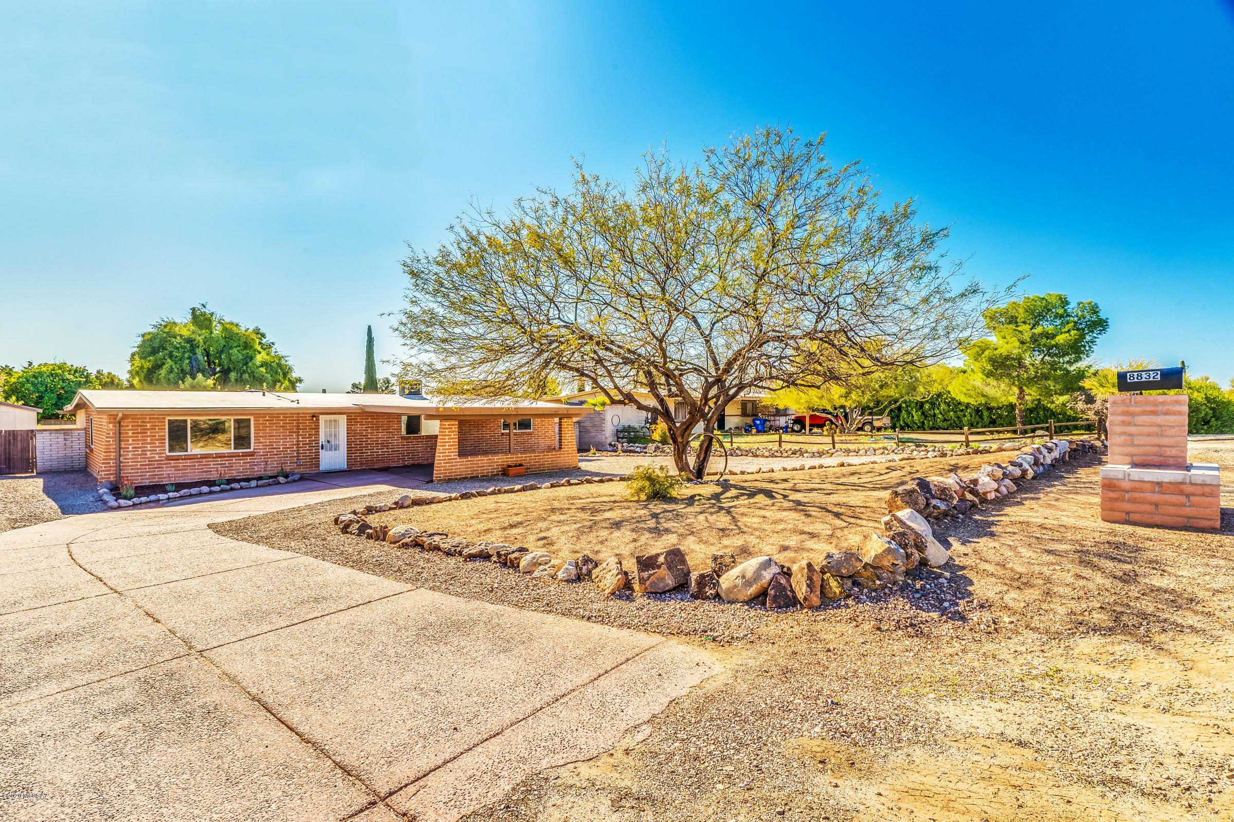 No showings until Friday, March 6th!  This home is the HIDDEN GEM that you have been looking for on the eastside. 1970 adobe block home on a 10,000 sq foot lot. This home has been tastefully updated with all of the amenities of 2020 but the character and charm of a mid-century home. The concrete floors complete the all new kitchen with granite counter tops. The huge island is the focal point of this grand kitchen and great room. You will enjoy the easy care backyard that is perfect for entertaining. The pool has been remodeled and the large outdoor bar awaits your guests. The bathrooms are updated with all new fixtures and custom tile surrounds. Fresh paint, fixtures and new carpet in all of the bedrooms. Great location near Sahuaro High School, shopping, restaurants and easy commute to DM