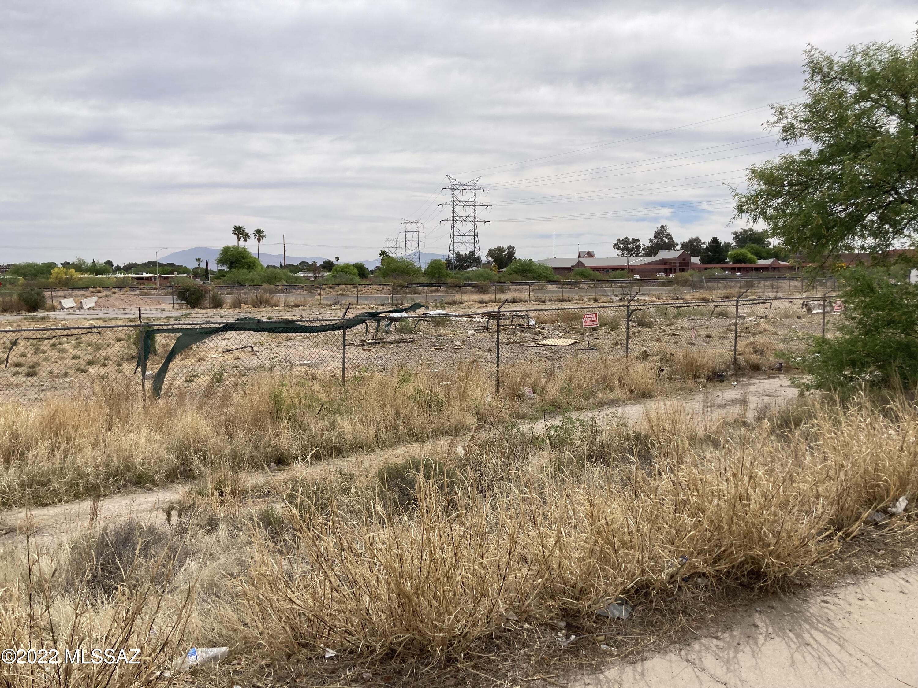 Two lots - 1/2 acre total - completely chain link fenced - faces Nogales Hwy and backs to Fletcher - great for light industrial/retail/auto, etc - Two lots in this package Pima 137-04-1180 & 1190 - lots can be sold separately at $80,000 each