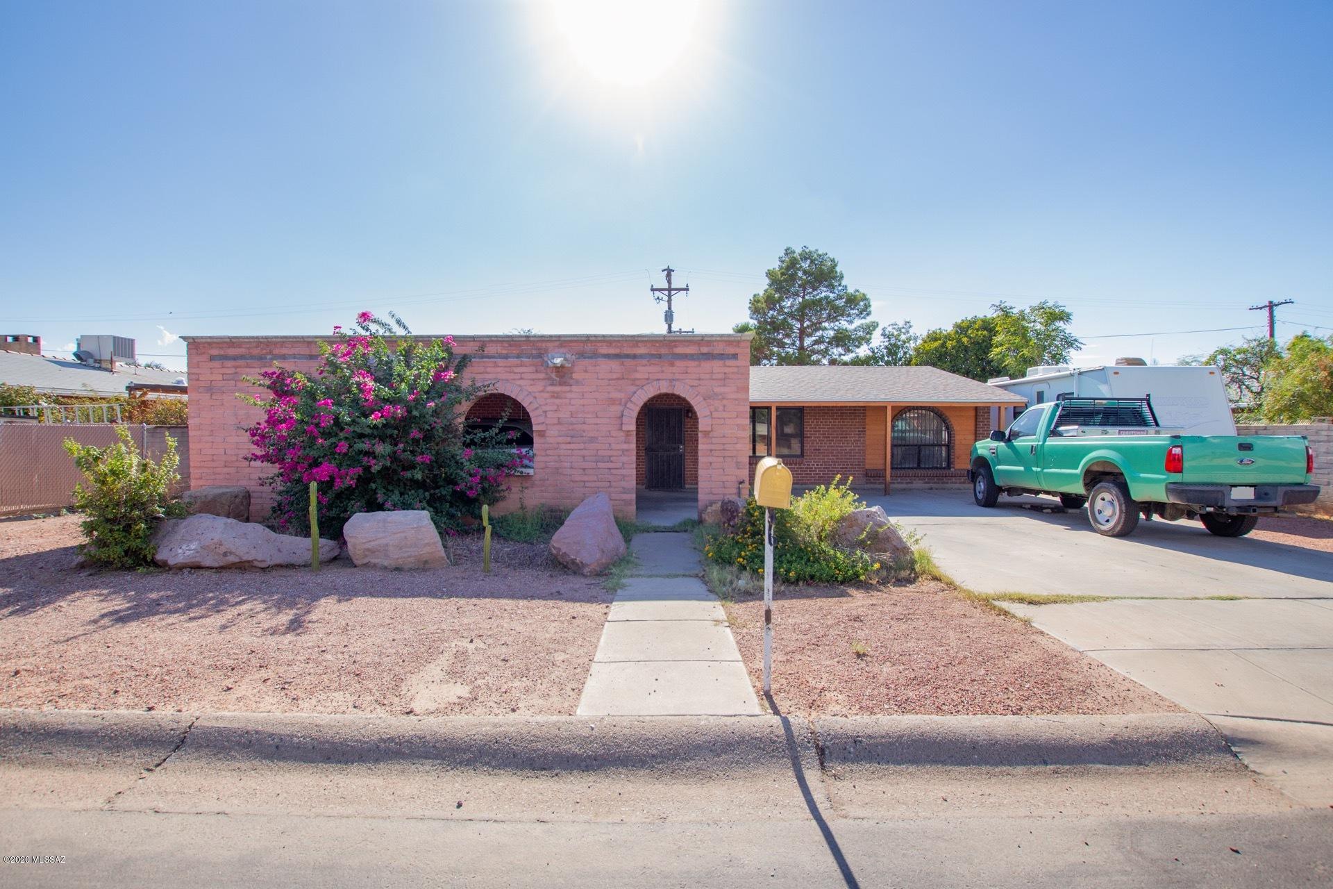 This Spanish style home in the heart of Central Tucson (Only 5 minutes from Downtown & Reid Park) is a full remodel, loaded with custom touches. Your next home includes: 20 inch tile throughout, large living room, dining room, no popcorn, spacious kitchen with new ss appliances, quartz counters, newer cabinets & moorish style tile backsplash. All new bathroom with new tile shower, vanity, Spanish style tile, new toilet and fixtures. Rooms are spacious & large windows have arches. Back yard is complete with extended porch,  huge workshop, storage, tool shed, built in grill, alley access, sandbox, mature fruit trees, block wall, lots of privacy.  House also has security doors and windows, rv parking, lots of parking spaces. Quiet street.Bristol ends at bike loop - easy path to UofA or DT.
