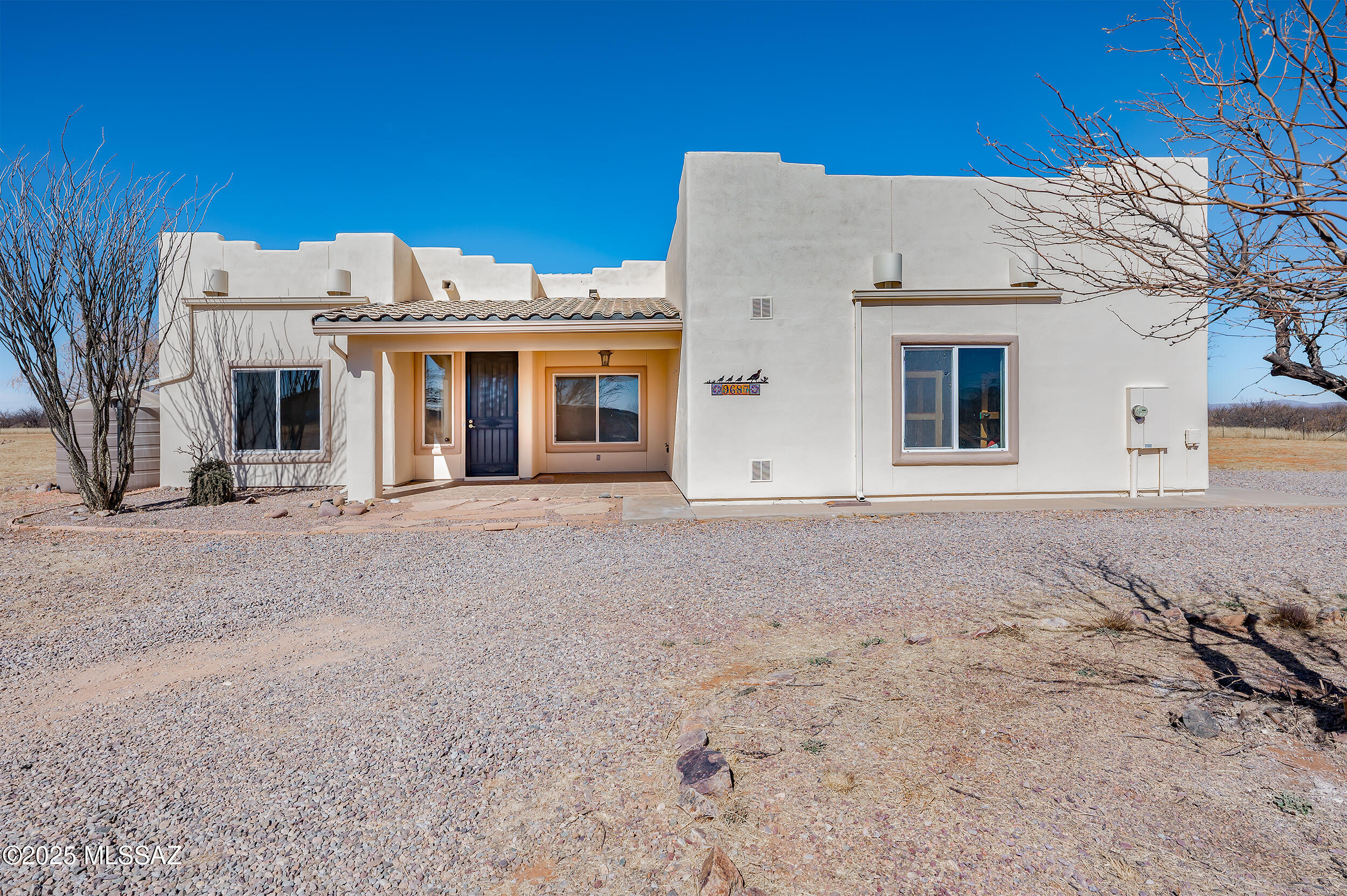 This 2,400+ sq. ft. home on 8.7 acres in the gated Three Canyons subdivision offers stunning mountain and valley views with plenty of space to spread out. Featuring 3 bedrooms, 2 bathrooms, two family rooms, a dedicated office, a dining room, and an eat-in kitchen, the layout is designed for both comfort and functionality. The master suite is a true retreat, with double doors, a garden tub, separate shower, dual sinks, and a walk-in closet.
The outdoor space is built for both relaxation and entertainment. A heated pool, hot tub, and beehive fireplace set the stage for enjoying Arizona's beautiful evenings. There's also a dedicated entertainment area, plus room for horses if that's on your list. A large two-car garage with built-in shelving and a backyard storage shed provide extra space for tools and equipment. Solar panels add efficiency, and all appliances, including the washer and dryer, are included.

With 5.5 acres fenced and just minutes from Ramsey Canyon and Sierra Vista, this home offers privacy, security, and easy access to nature. If you're looking for a well-equipped desert retreat with room to breathe, this one is worth a closer look.