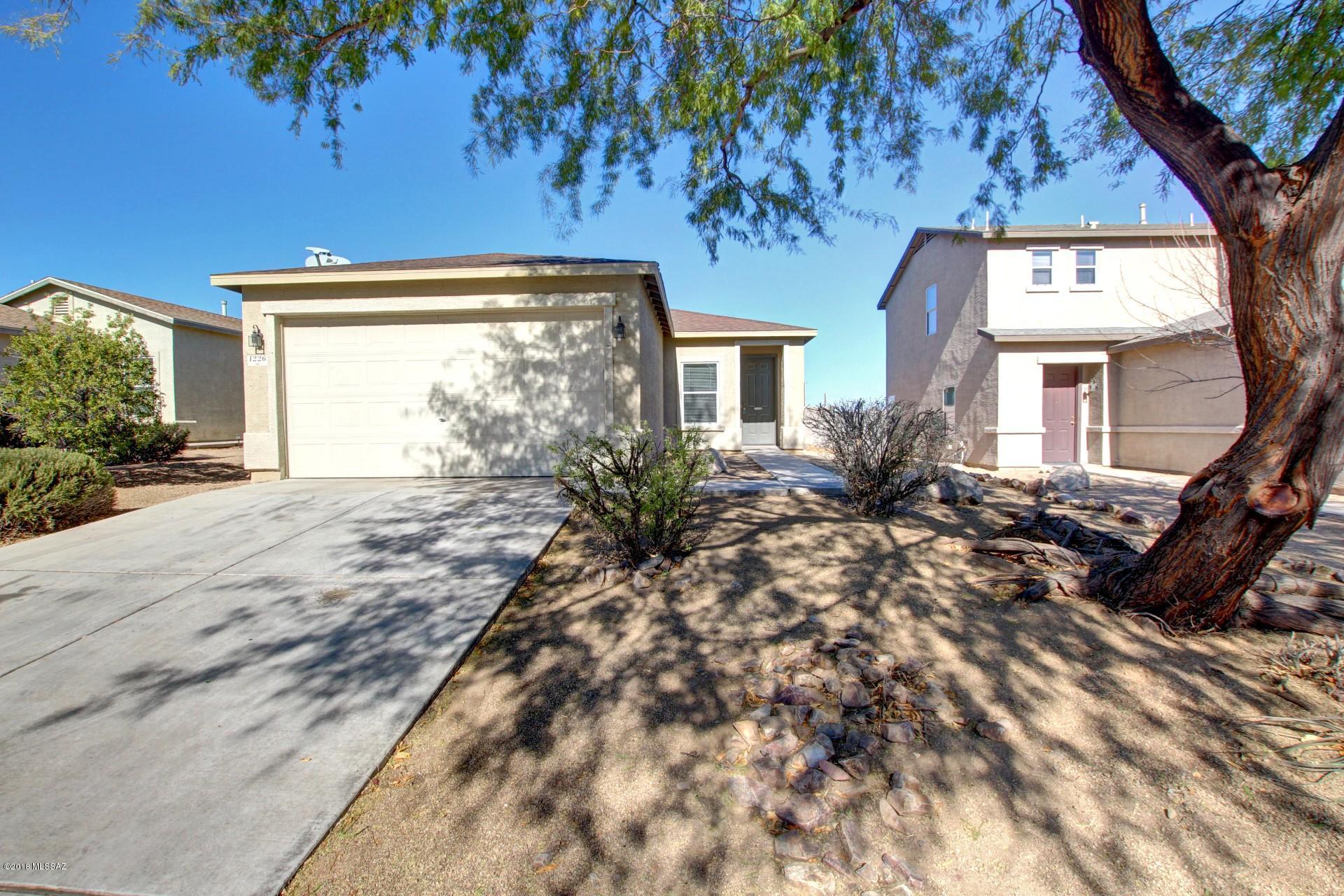 Great move in ready home in a great Sahuarita location! Open floor plan with 3 spacious bedrooms and a neutral color palette throughout. Eat in kitchen features black appliances, pantry, and ample cabinet & counter space. Each bedroom has walk in closets and plush carpeting. Master includes an adjoining bath. Serene backyard has a covered patio, low care landscape, and views of the distant Catalina mountains! This home is ready for your personal touches! Owner/agent