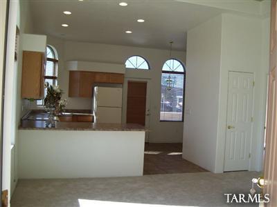 Charming town home in gated Mona Lisa Village 55+ community. Vaulted ceilings, close to parking, ceiling fans, washer dryer hook ups, enclosed front & rear patios, wrought iron doors on front & back, bright kitchen, huge walk in closets, etc.