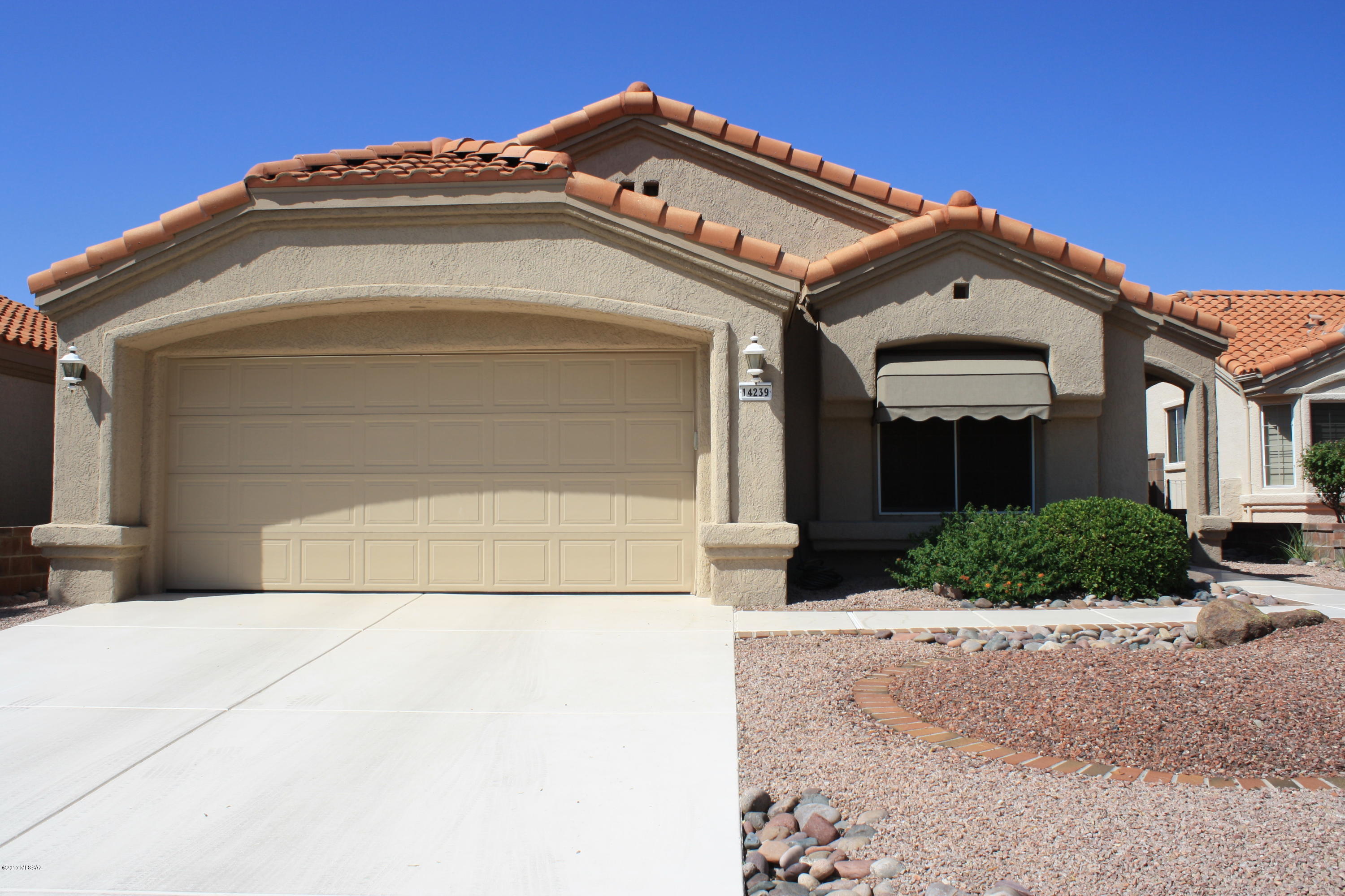 Wonderful home in Sun City Oro Valley! NEW ROOF! Home has scored concrete floors by Rogo with NO carpet! Epoxy coated garage floor, rolling exterior shutters throughout house, mature landscaping in front and backyard! Enjoy the beautiful mountain views from backyard and front yard. Kitchen has quartz counter tops and a ceramic sink! Don't miss out on this. 	HOA fee includes Clubhouse; Pool; Recreation Room; Spa; Tennis Court