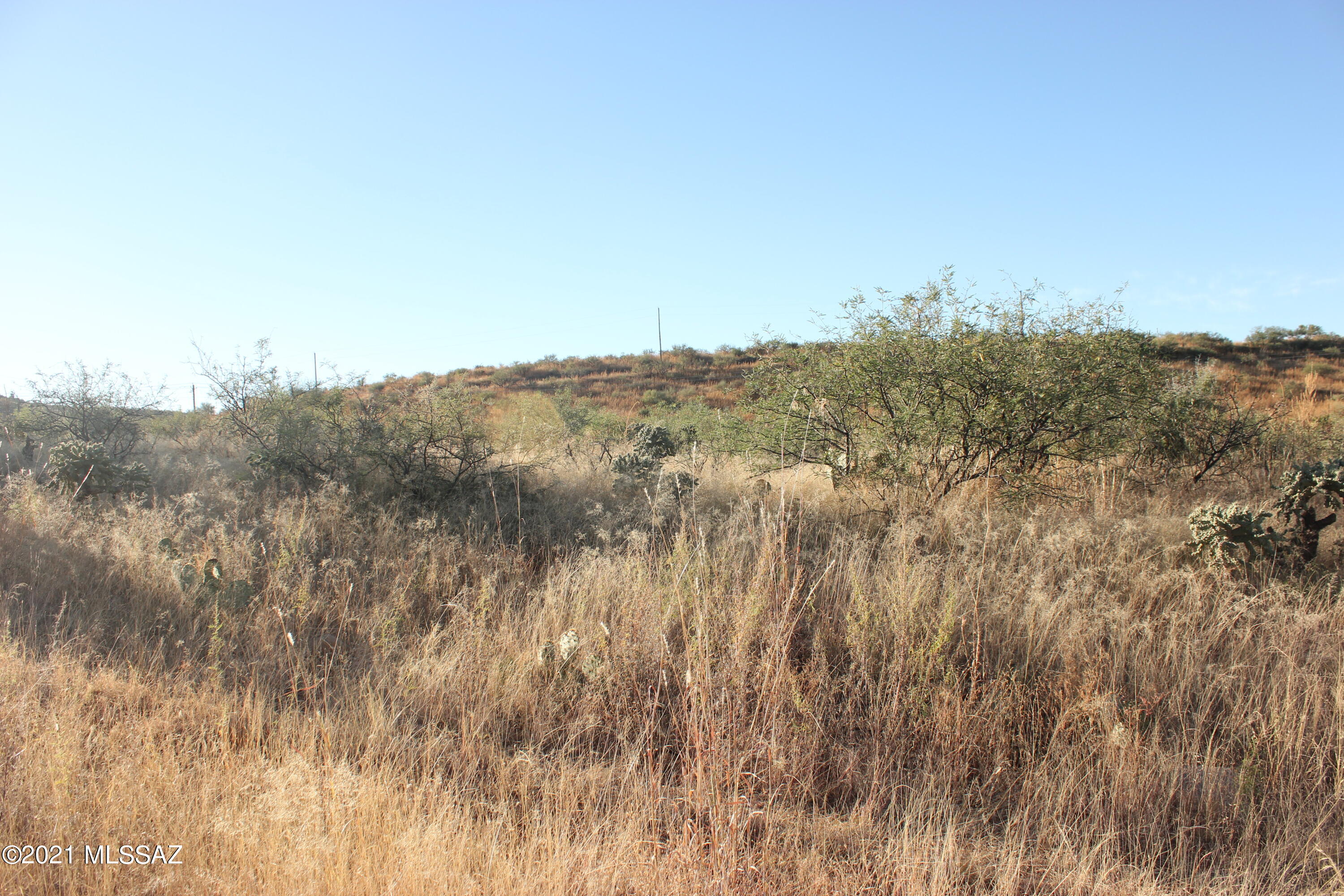 Gently sloping lot with nice views.  Electric at the street and water probably is also but should be verified with water co.