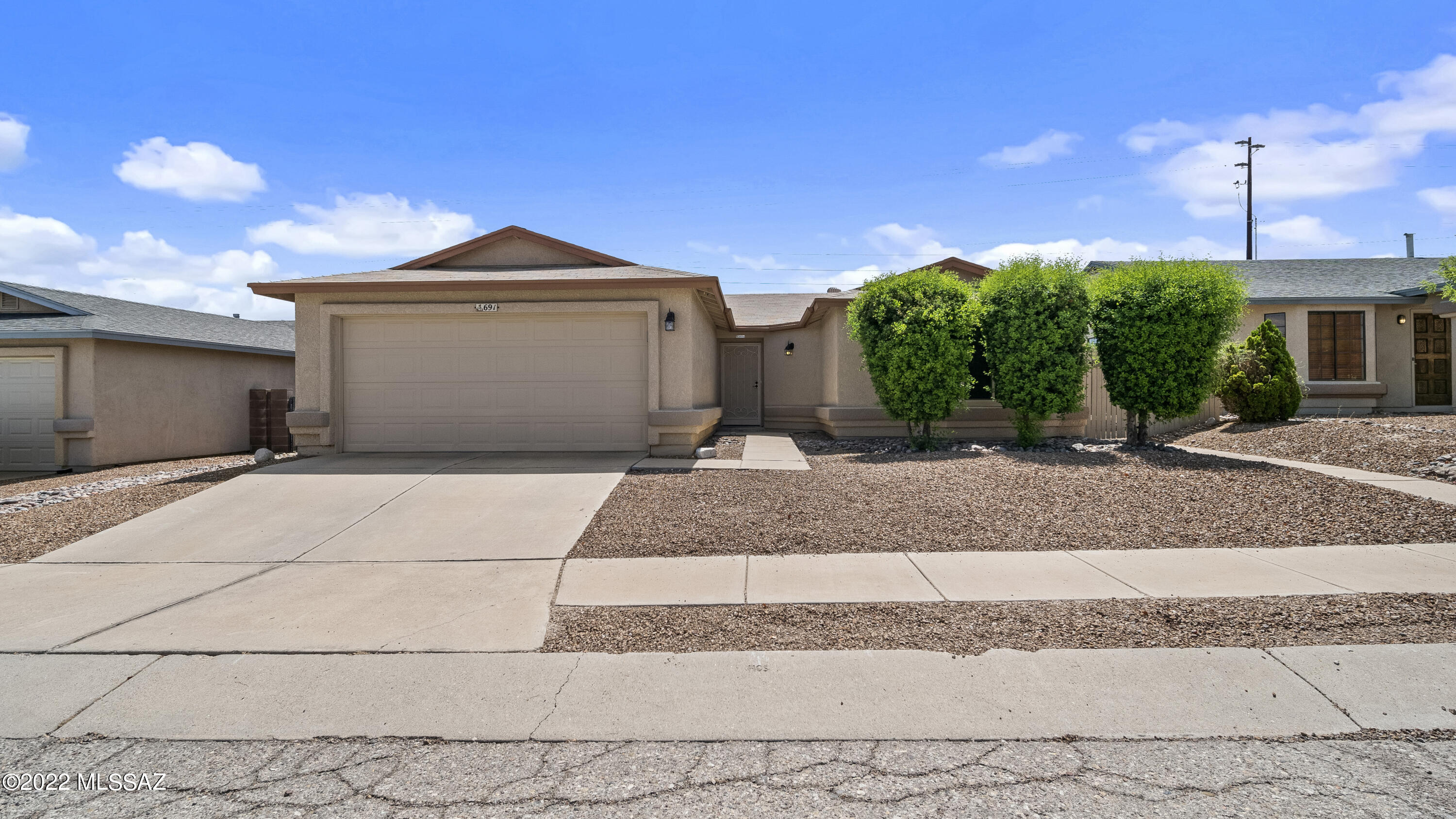 Not a single thing was missed when sellers meticulously remodeled this home. From the elaborate pull outs in the custom kitchen cabinets, noise cancelling windows throughout the home to the routeless espresso blinds. They thought of everything! These top notch double hung windows keep the home quiet and even pop out for easy clean! The kitchen boasts bright white cabinets with soft close hinges, quartz countertops and stainless steel appliances. Throughout the home, you will find elegant dark wood flooring with ceramic tile in the kitchen, bathrooms and laundry room. Cozy up in the winter with your electric fireplace that warms up the living room in minutes while watching tv or enjoying a good book with hot chocolate. The master bedroom offers his and her closets with an en-suite that was designed so purposefully. From the spacious cabinets and drawers, double sinks with lighted mirror and the tiled in shower! Laundry room leads to the garage and is complete with tall/deep cabinets for all your storage needs. Bring your clothes and move right in!