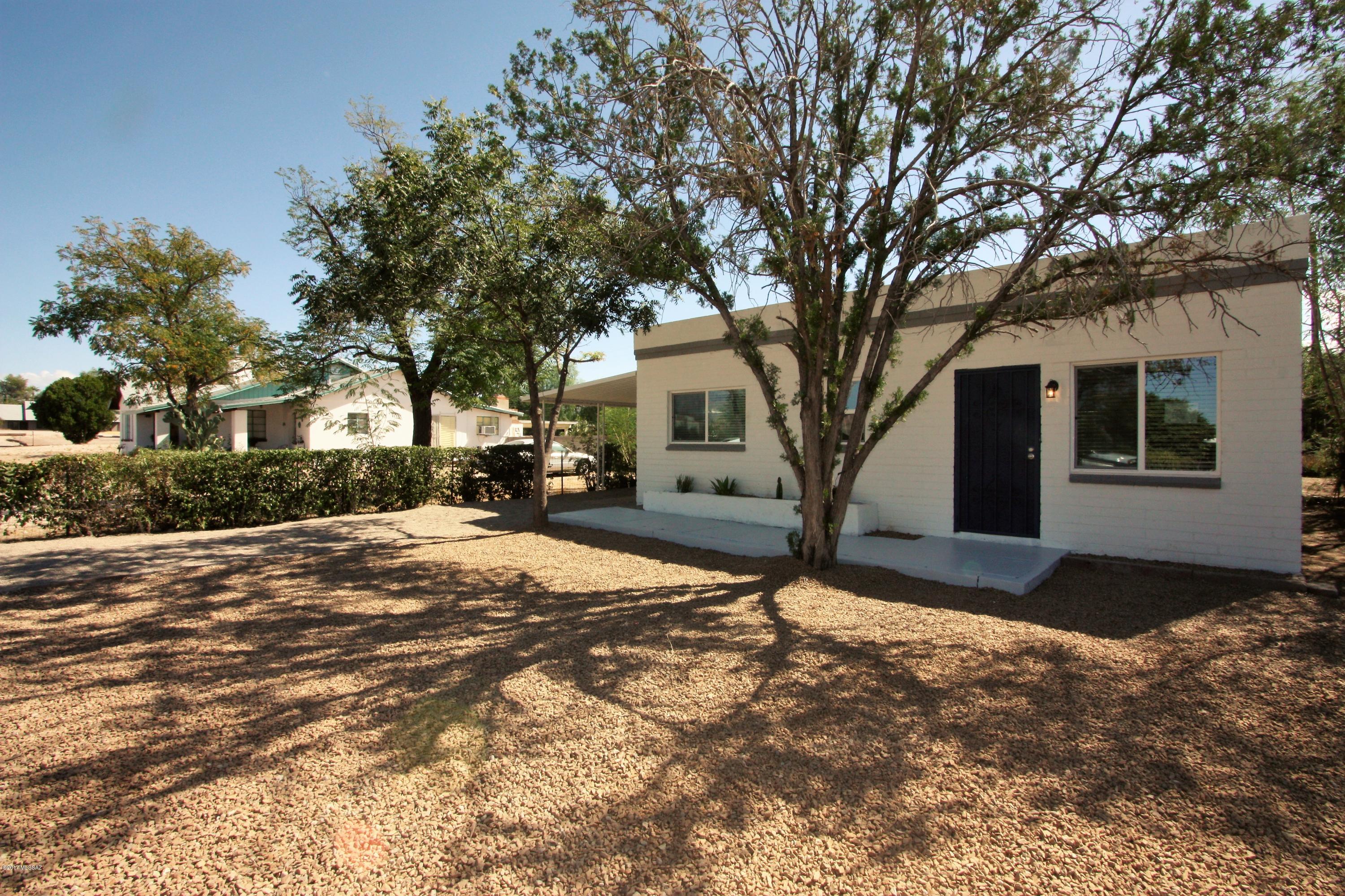 Brick and beautiful mid century modern home located in Central Tucson. Excellent curb appeal with updated paint and cacti in planter box. Large front and backyard. Super clean and cozy inside. Fireplace in common area. Neutral easy care flooring and custom two tone paint throughout. Walking distance to Nash Elementary. Agent Owned.