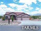 Come live in this elegantly appointed 3-bedroom, 2-bathroom contemporary style home in the desirable Rancho Del Lago community in Vail, AZ, just southeast of Tucson. Located just minutes from I-10, Colossal Caves, the Saguaro National Monument, and less than a mile from the fabulous Rancho del Lago Golf Course, this spacious home has a den, large up-graded kitchen with double-oven, breakfast bar, walk-in pantry, living area with wall of windows, built-in shelves, and a fireplace. Also has a beautifully landscaped backyard, spacious master bedroom and master bathroom with garden tub and dual sinks, 3-car garage, covered patio, and mountain views. Non-smoker and no pets preferred.