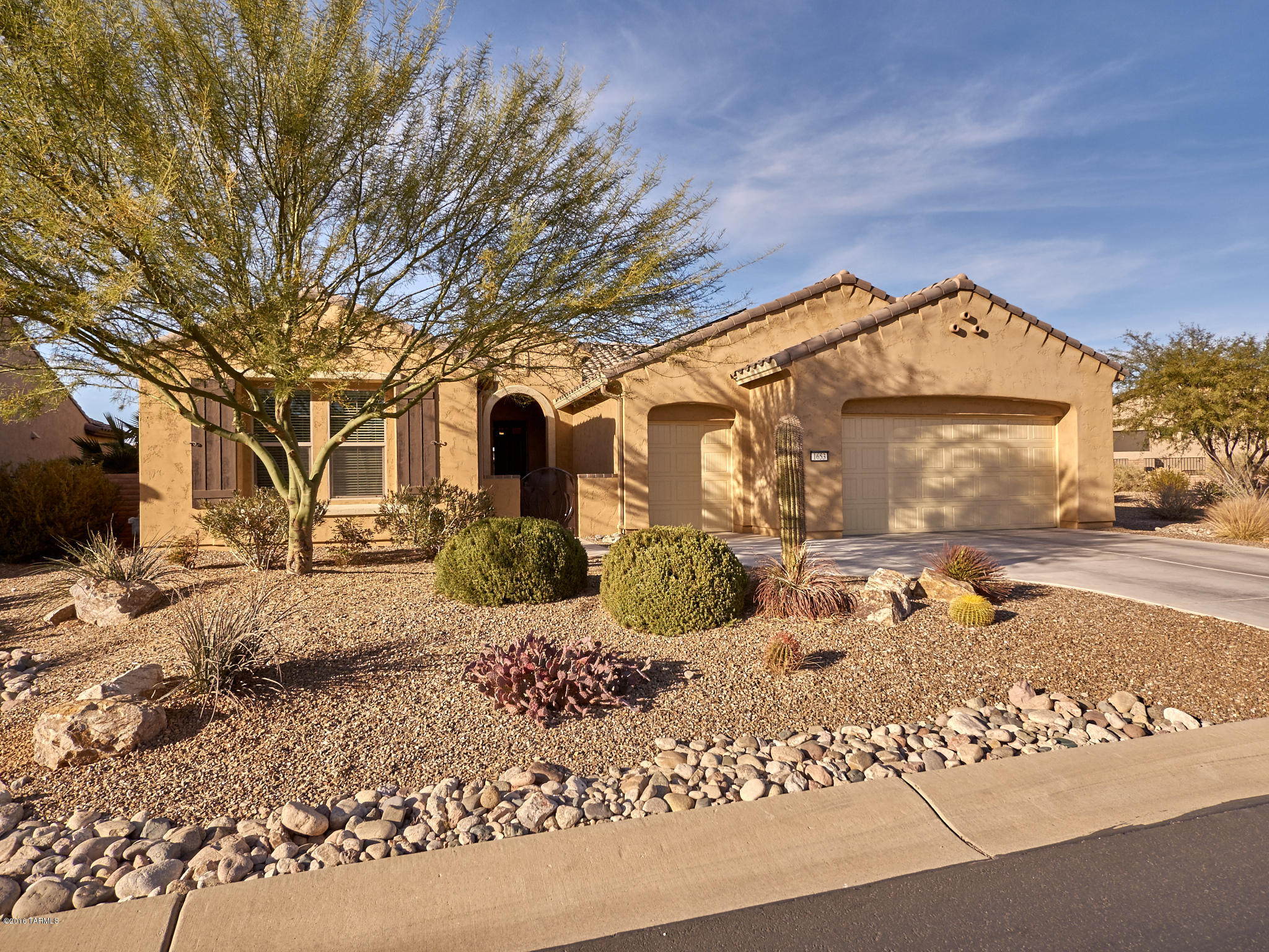 Must See!  Beautifully upgraded Cortez model with Stainless Steel Appliances, Quartz Kitchen Counter top and Impressions Fine Marble Bathroom counter tops, Tile throughout except bedrooms, extended and expanded garage with epoxy sealed floor.  Home equipped with leased solar electric for $58.00 monthly.  This home backs up to open space and is next to a common area.  You can enjoy watching the beautiful sunsets from the extended covered patio. This home is located in the resort community of Quail Creek County Club.  The community offers 2 pools, pickle ball and tennis courts, bocce ball, arts and technology center, 27 holes of golf, restaurant, club house and so much more!