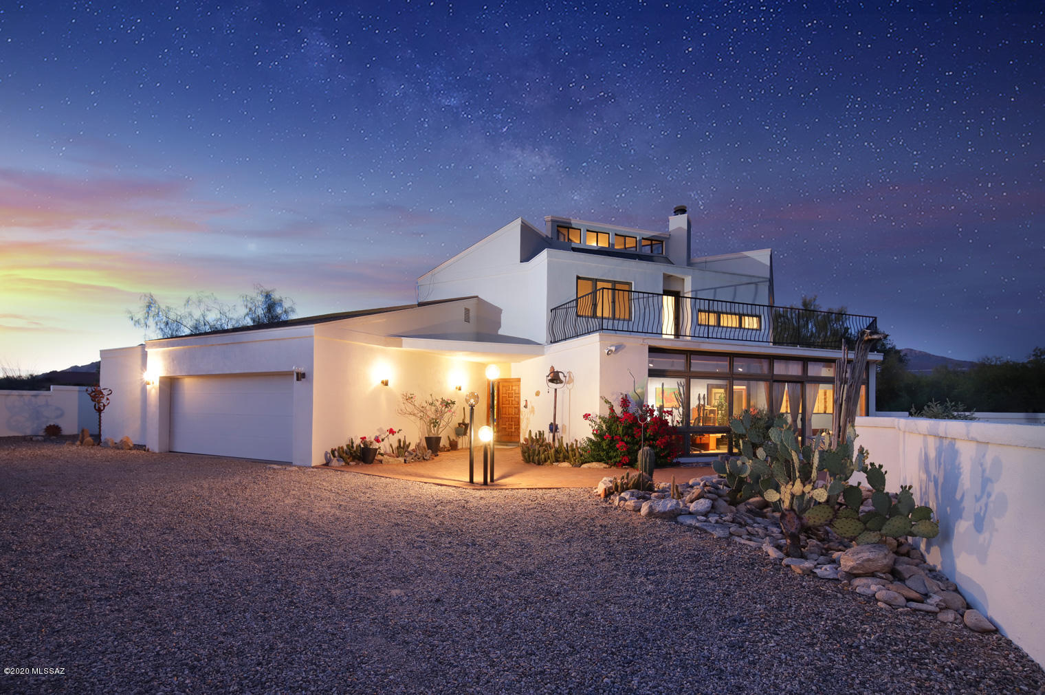 Don't miss this one of a kind custom home w/gorgeous mountain, sunset & city light views! The unique architectural details are sure to delight w/walls of windows, wraparound balconies & interior tower w/360 degree views! Fabulous backyard features a sparkling pool, large covered patio, low care landscaping w/twin saguaros & lovely brick pavers. Inside you'll find a well-appointed kitchen w/modern cabinetry, SS appl & a comfy nook. Nice family room off kitchen & the living room has a cozy fireplace. Arizona room w/great backyard views can be an office, studio or whatever suits your needs. Master suite has an alcove & ensuite bath. One bedroom & full bedroom downstairs. Slate floors, clearstory windows for lots of natural light, solar water heater, dual cooling & no HOA!