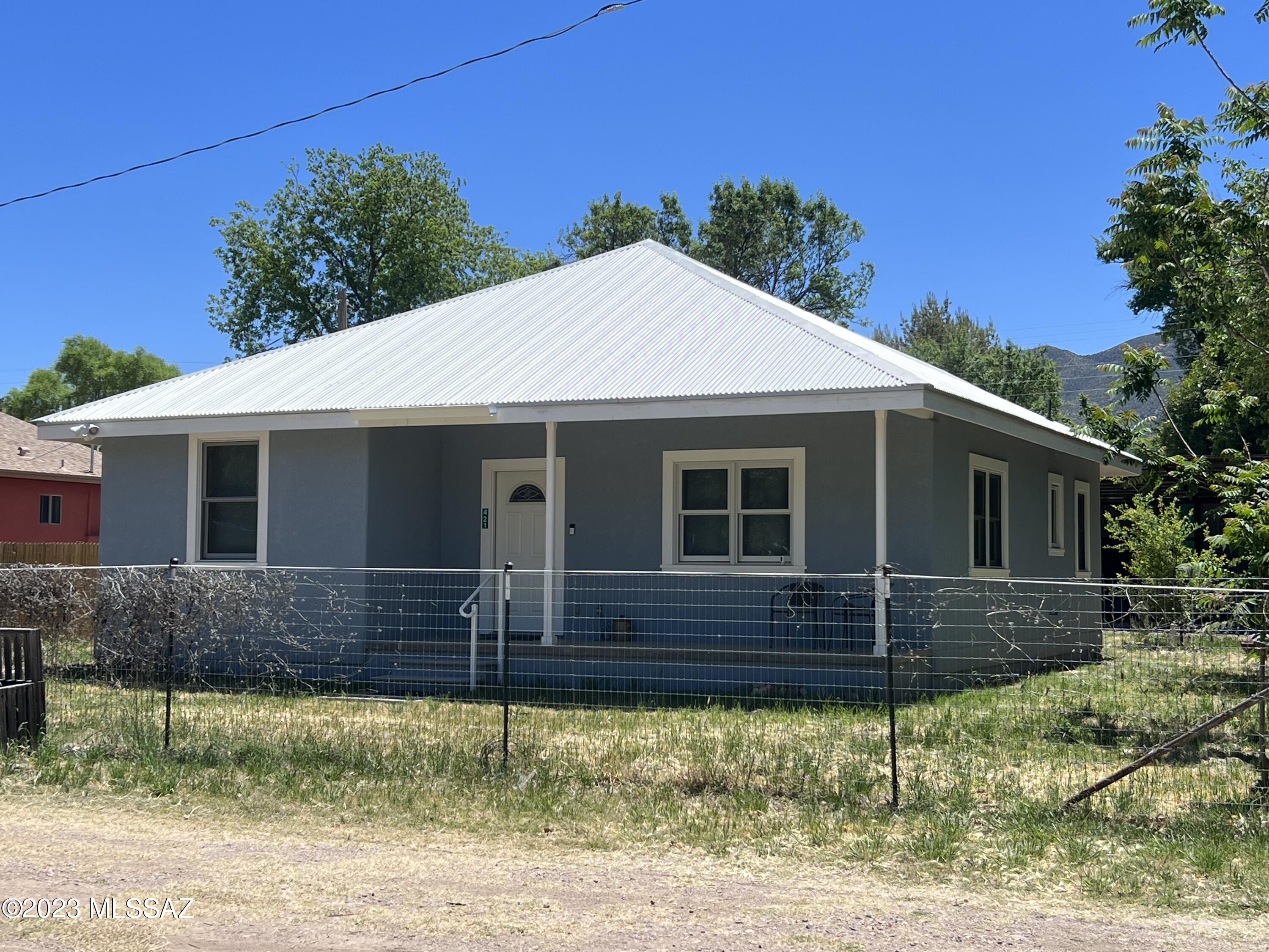 Cute, Cute, Cute! Great location in the Town of Patagonia. Within walking distance to nature trails, town amenities, entertainment all things Patagonia. Save on utility bills with this 2017 Ted Piper Rastra built 2bdrm, 2bath 1133sqft cozy home that features: Custom alder cabinets, beautiful slate countertops, custom built breakfast nook table and benches,  water softener, laundry room with storage cabinets,  custom blinds, metal roof, workshop, large shed row carport, covered front and back porches to enjoy the amazing year round weather that southern Arizona has to offer.
