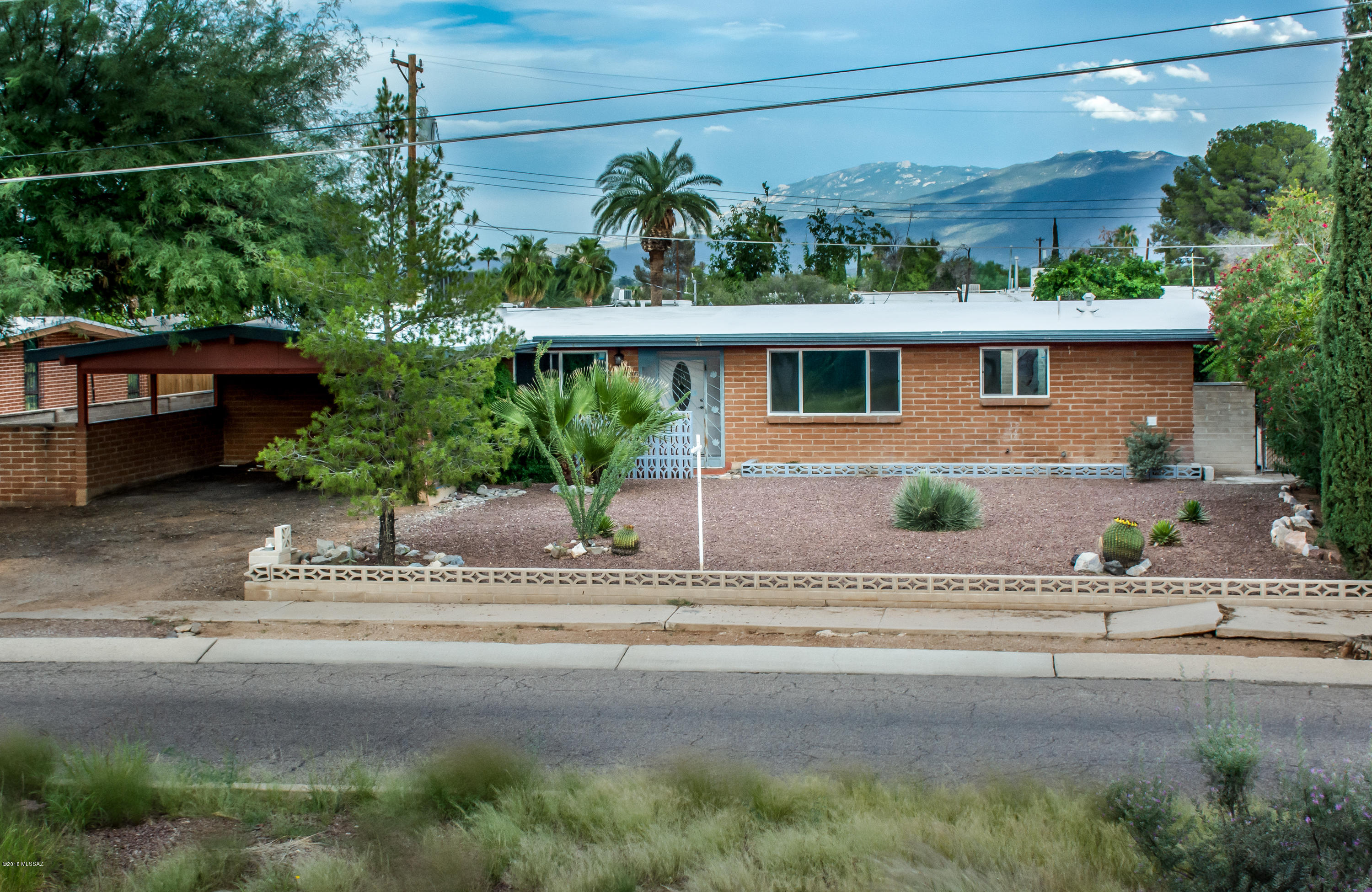 This is a beautifully remodeled home in a great east side neighborhood. 3 bedrooms/ 2 baths.  All new A/C, furnace,  carpet, windows, doors, electric panel, lighting, vanity, title, toilets, Birch wood floors, paint, textured all the walls, ceiling fans, electrical outlets, cool coated the roof.  Brand new kitchen with new cabinets, countertops, microwave, electric stove, and dishwasher.  Come take a look and see all that it has to offer.