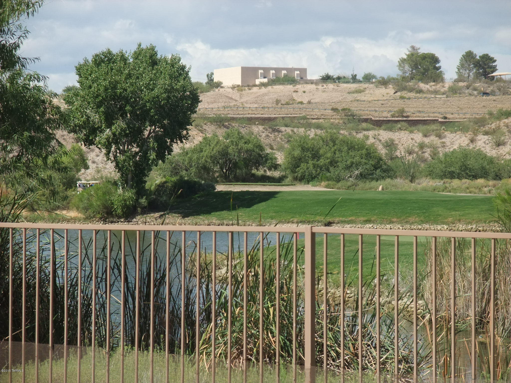 RARE opportunity to purchase a home on Rancho Del Lago Golf Course with a gorgeous lake view for under $160,000!! It feels like a lush waterfront property! Potential 3rd bedroom is large, but has no closet or door, currently a den. Open floor plan with   island kitchen.  Brand new carpet throughout! Great quiet low traffic cul-de-sac location. Spacious extended patio and yard are perfect for entertaining.