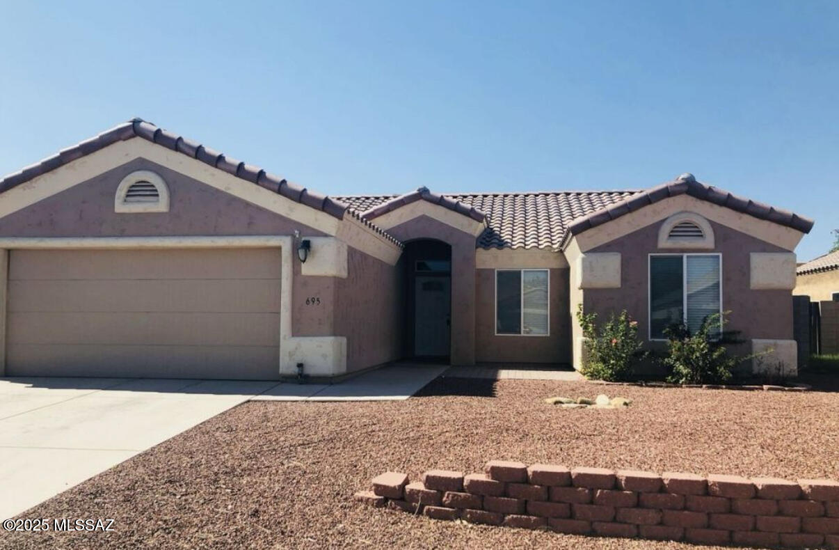 Here's a Handsome Home!  It's in a Great Location and, it's Affordable!  It is within walking distance to schools while a few minutes of driving can take you to all that Safford has to offer.   Both back and front yards are low maintenance landscaped, with automatic watering systems.  The home features vaulted ceilings, ceiling fans, and walk-in closets. The Kitchen includes granite counter tops, and beautiful cabinets, with crowned molding on all upper cabinets. All kitchen appliances are included.  In both bathrooms you will find Granite countertops and tastefully tiled shower surrounds.  This home has a lot going for it.  If you are interested you should ''go for it'', before it's GONE!