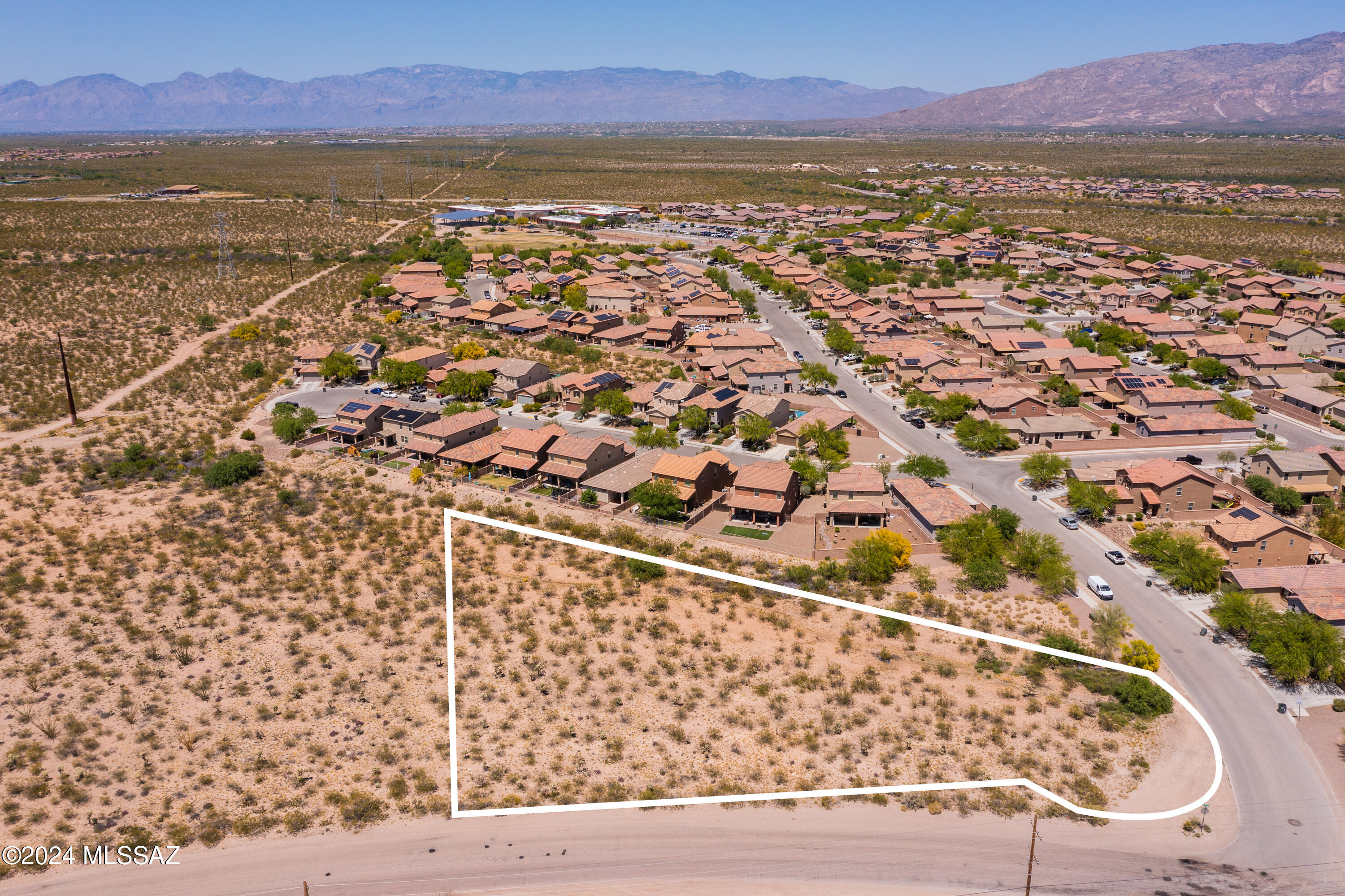 1.40 acres located in the Vail School District with close proximity to shopping and amenities. Esmond Station K-8 is located in the subdivision to the North. No HOA allows for many possibilities. Mountain views, located on a corner lot and paved roads add to the enticement of this vacant lot. 49.6% of the lot is in Zone X (Topo survey completed). Utilities are available at the intersection of Crowley Brothers Dr and Old Vail Road (East boundary of lot). City of Tucson R-1 zone. Lot is located in ADC-3 DMAFB Approach-Departure Corridor. Lot can be purchased separately or in conjunction with 11125 E Old Vail Road, 1.50 ac (205-64-074B) for a total of 2.9 acres. Buyer to verify with City of Tucson if horses are permitted.