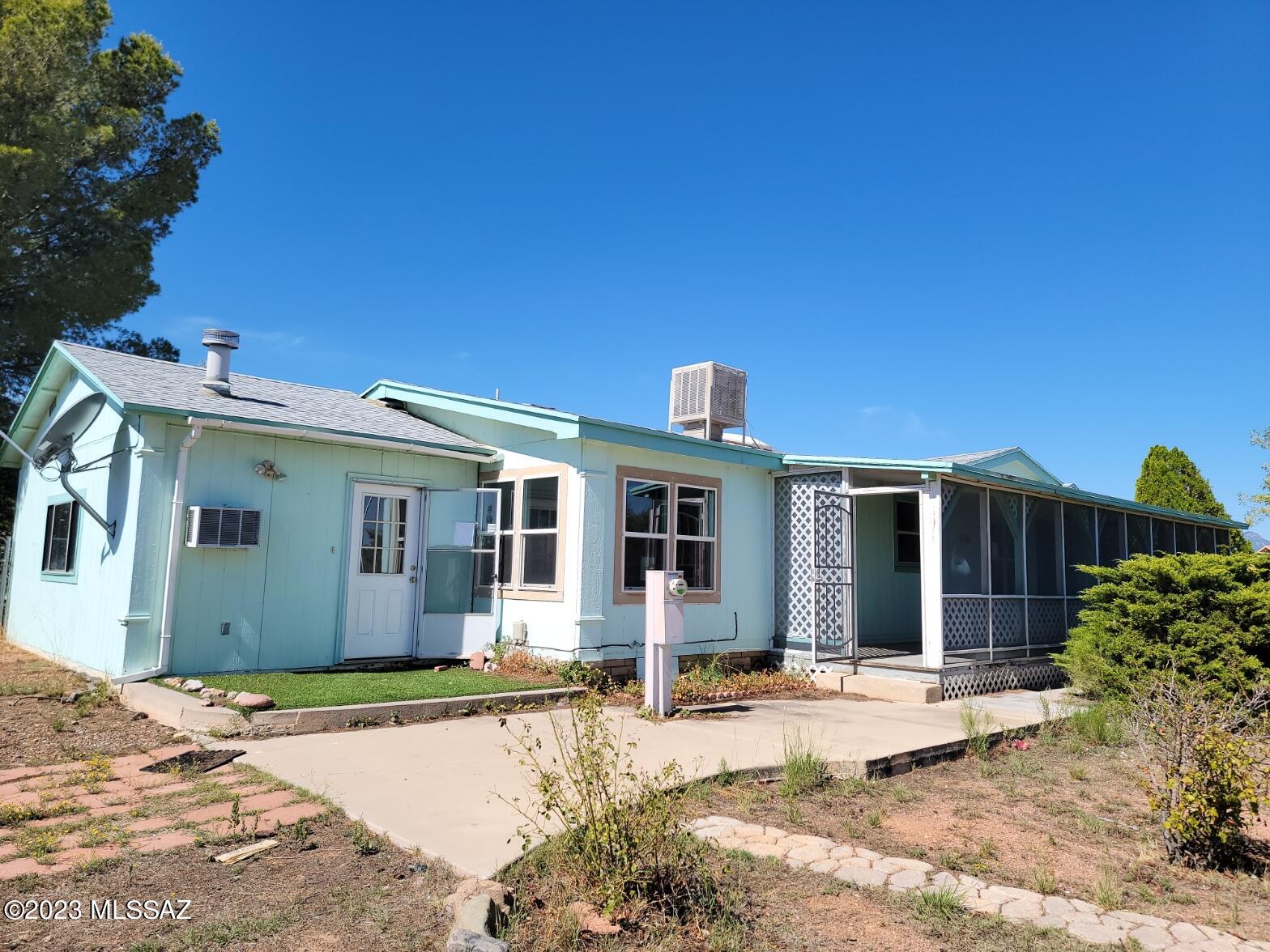 3 Bd 2 ba Manufactured home with addition . Great location with sweet views! Price is RIGHT ! Dont miss out on this little gem. Fenced yard with mature tree's. Small workshop with power and another storage shed.