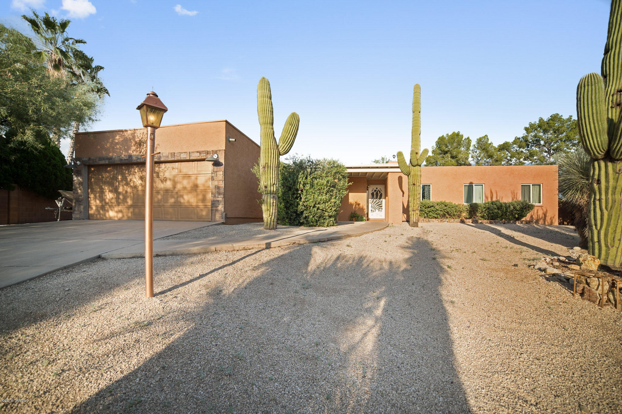This desirable Sabino Vista home has been completely renovated with new large tile and new double pane windows and stone front. The home features 5 bedrooms ! A Master Suite with fireplace, his and hers walk in closets, French doors and clearstory windows. Charming brick style beehive fire place in family room. All bathrooms have been beautifully remodeled and 2 have spa jacuzzi tubs. This house has wonderful natural light through out the home.  Updated kitchen with all stainless steel appliances and large pantry. Backyard is incredible!  A large space perfect for entertaining with a bar, sink, pool, Mastercool and bbq island. Garage has epoxy floors and very nice enclosed storage.  Additional storage with large barn style shed with loft. Come see for yourself this lovely home.