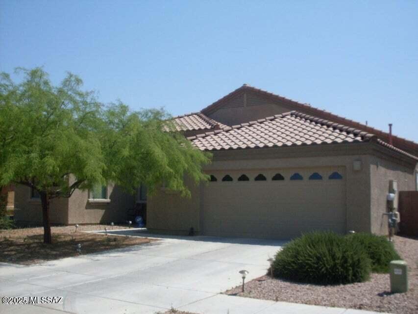 Fantastic home in a great neighborhood. This home is over 1900 sq feet with a huge great room and kitchen. The home has granite counter tops, 42 inch cherry cabinets, large 2 car garage, huge back yard with open space behind for privacy. Location is close to I-10, Davis Monthan, Raytheon and schools.  Call agents for an easy appointment.