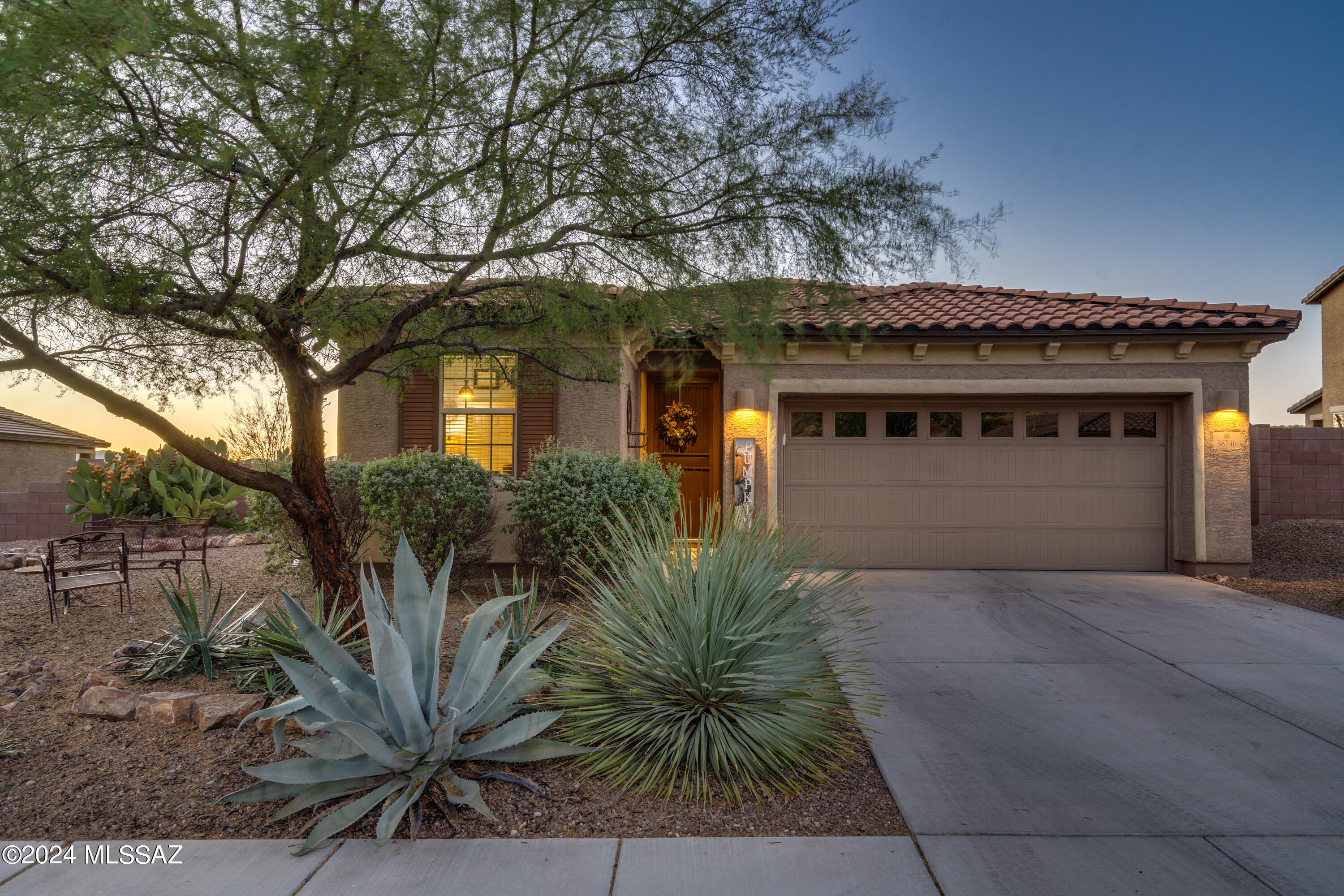 This beautifully updated home offers a seamless blend of style & comfort. The spacious layout features tile flooring throughout the main living areas, w/ plush carpeting reserved for the bedrooms. The granite kitchen is equipped w/ stainless steel gas appliances, perfect for any home chef. Relax in the spacious primary suite, complete w/ an upgraded bathroom featuring granite countertops, a soaking tub, a separate shower, & a large walk-in closet. The split-bedroom floor plan includes 3 bedrooms plus a den, providing plenty of space for family or guests. You'll also appreciate the convenience of an independent laundry room & a 2-car garage, along w/ the added benefit of a whole-house water softener. Step outside to a beautifully landscaped backyard w/ low-maintenance vegetation, artificial turf, & an extended paver patioall set against the backdrop of stunning mountain & desert views w/ no rear neighbors. This move-in-ready home offers the perfect combination of elegance & convenience in the desirable Eagle Crest Ranch community!