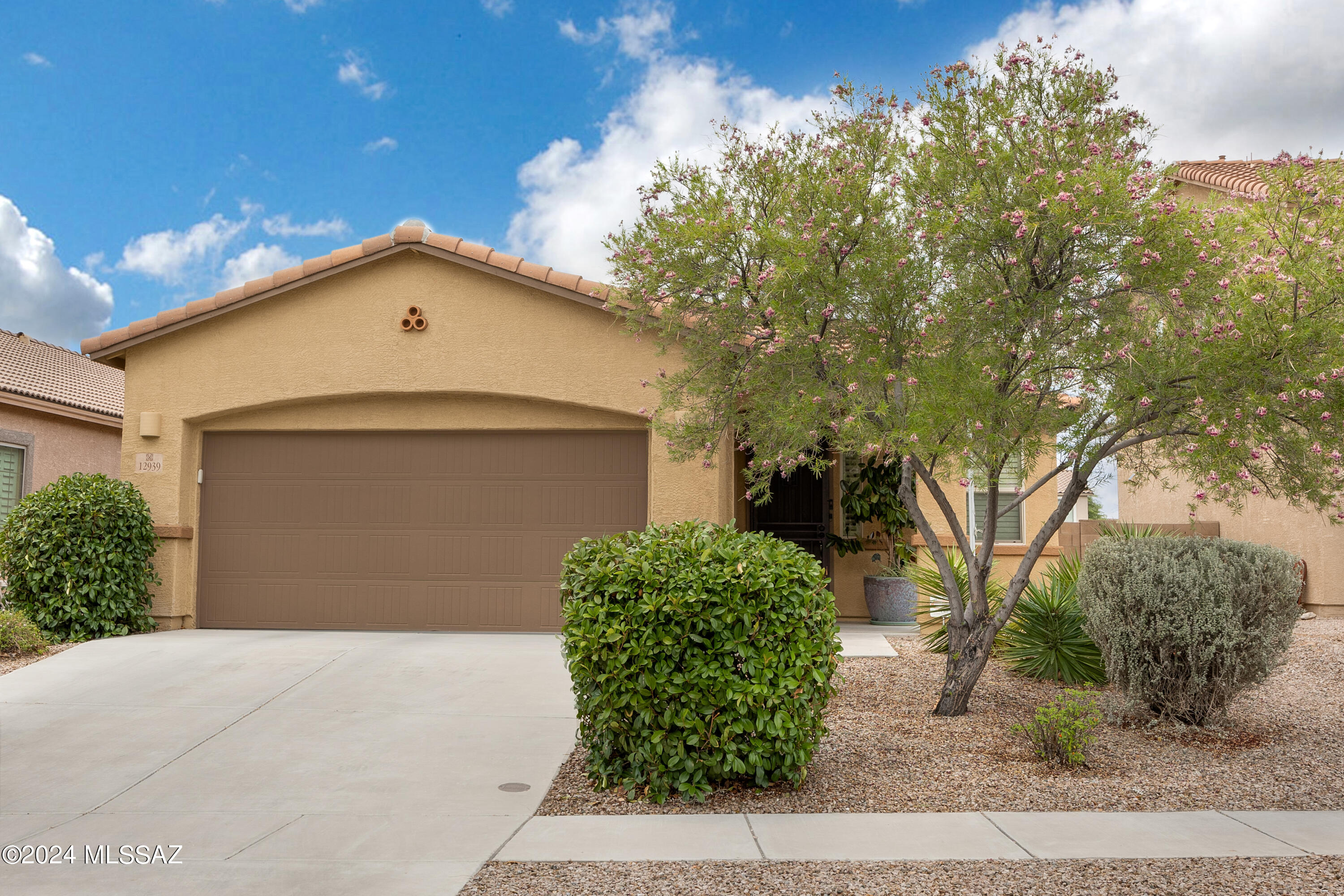 Stunning three bedroom two bath home loaded with upgrades. The home features a great room concept and gourmet kitchen with island, breakfast bar, five burner gas range and double oven. This home is a single story home with a two car garage. There is a large laundry room with washer dryer, freezer unit and extra storage. The home has tile floors throughout, huge owners suite, walk in shower, walk in closet and double vanity. The home is located in desirable Rancho Vistoso on a quiet cul-de-sac. Amenities nearby include, parks, playgrounds, trails for biking and walking, Oro Valley Hospital, shops and restaurants. Don't miss this home.