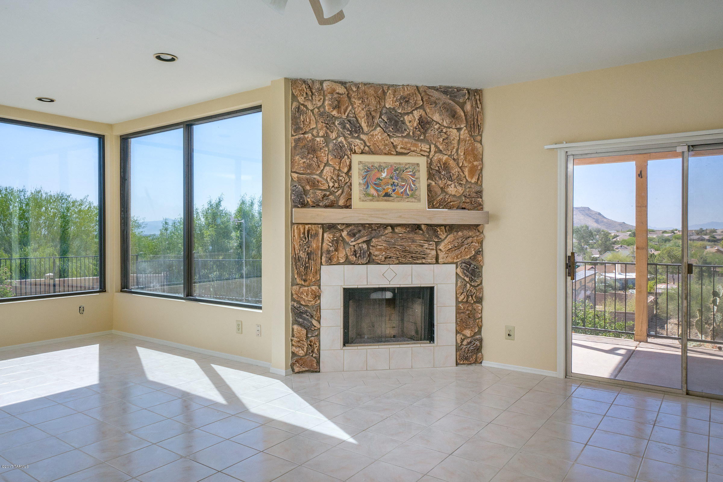 AFFORDABLE HOME WITH SPECTACULAR VIEWS!! A wall of new windows frame UNOBSTRUCTED VIEWS of the entire Tucson Valley! Ceramic tile, tiled fireplace, flagstone patio & REMODELED MASTER BATH WITH GLASS BLOCK ENCLOSURE (snail shower) & JACUZZI TUB. SOLAR PANELS for energy efficiency! Solar panels -- no purchase payments due.