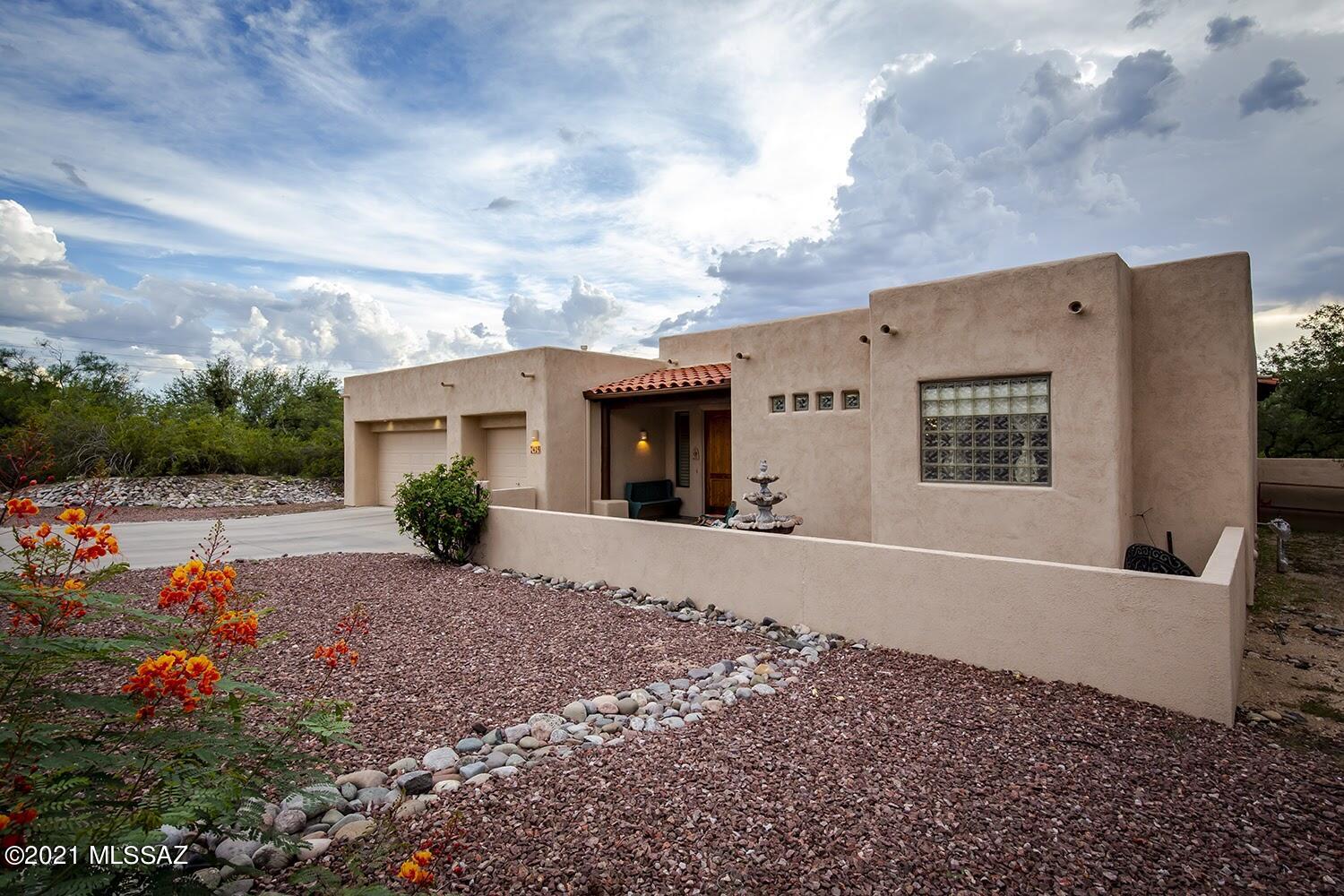 Gracious Family Home located in a quiet neighborhood in the sought after Tanque Verde Valley across from 49ers CC.  Arrive at your classic Territorial home through a welcoming courtyard.  Double entry doorway  invites you into large foyer to a home featuring high ceilings and natural light, separate living room, formal dining room, open Great Room w/beehive FP, cook's Kitchen w/new gas stove & built-in fryer, breakfast bar, granite countertops, large pantry, 42'' Cardwell Estate hickory cabinetry. Separate Master Suite, Spa-like Bathroom & walk-in closet.  Separate wing has 2 Bedrooms w/Jack & Jill Bath & 3rd bdrm/office & 1/2 bath.  Surrounded by mature mesquite trees, and protected on the west by a Greenbelt, is your large tranquil backyard... ...perfect to stargaze the dark sky, relax with the peaceful evening sunsets/morning sunrises, experience the Catalina-mountain shadows and the monsoons as they roll in from the east.  Partake in the festivities of 49ers CC without the membership obligation.