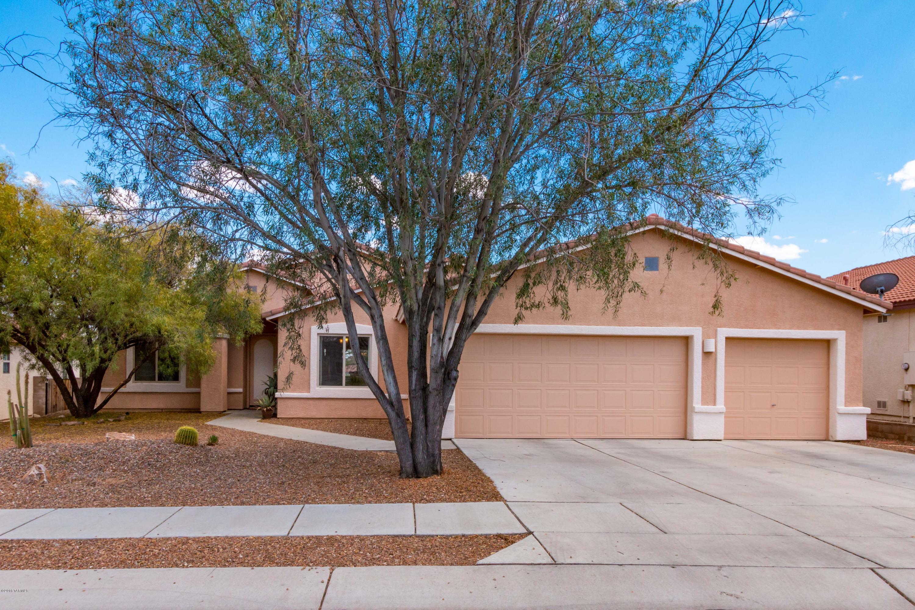 Move right in and feel at home in this stylish spacious 1 story in quiet gated community. Split floorplan. 3 CAR GARAGE. Oversized MBR suite w/custom walk in closet, dbl, sinks, walk in shower, garden tub. 2 More bedrooms and bath. Tiled throughout (no Carpet), Enjoy casual entertaining in the eat in kit, breakfast bar opens to fam rm & Dining area w/fpl, custom nooks and sliders lead to your private oasis w/no one behind you and views while you relax in your spa.  Walking trails and community pool.  Certified wildlife area.  Don't miss this.